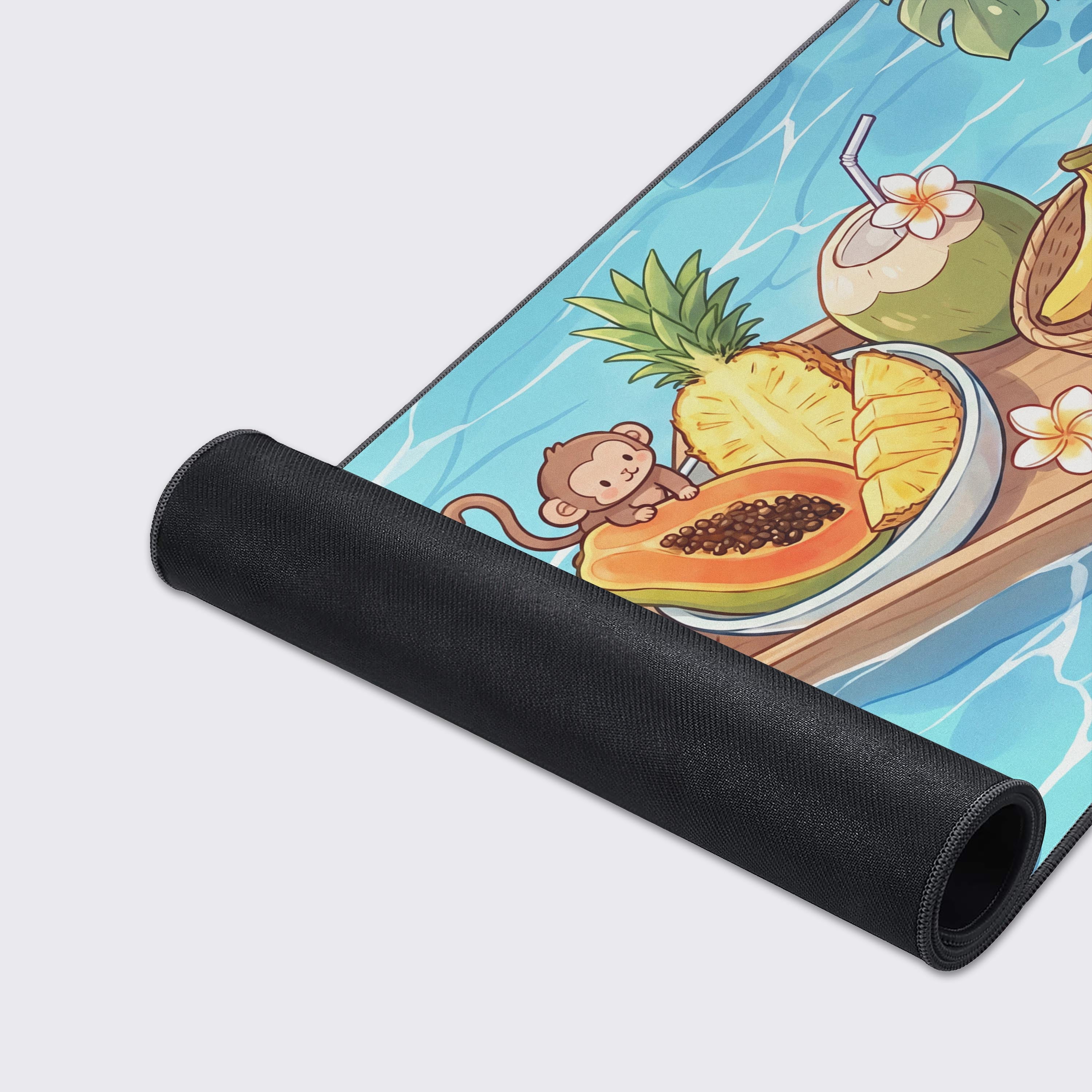 Detail of the sloth hanging from a tropical leaf on the right side of the vibrant blue water desk mat.