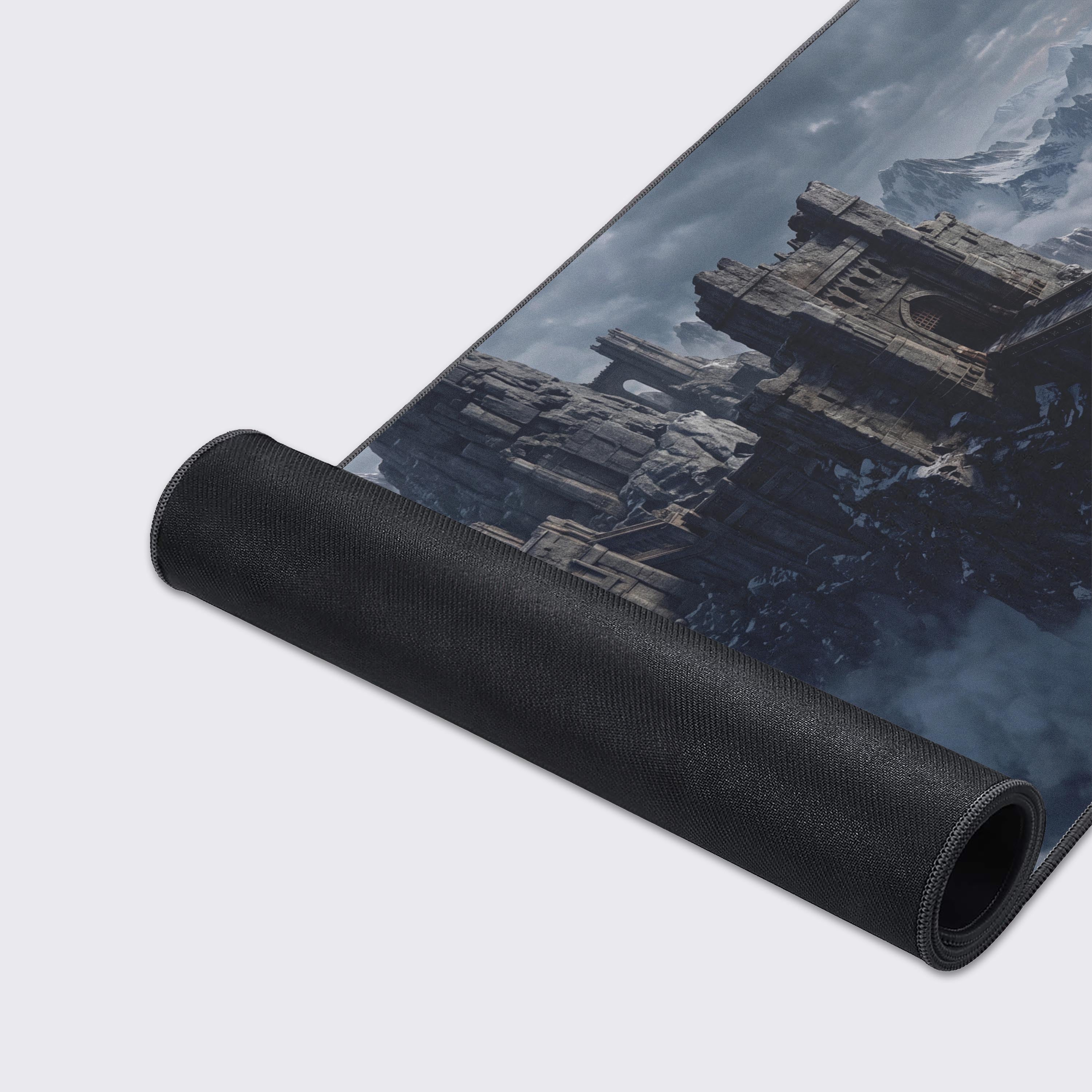 The fantasy mountain landscape artwork on the mouse pad, featuring dark skies and jagged snowy mountains