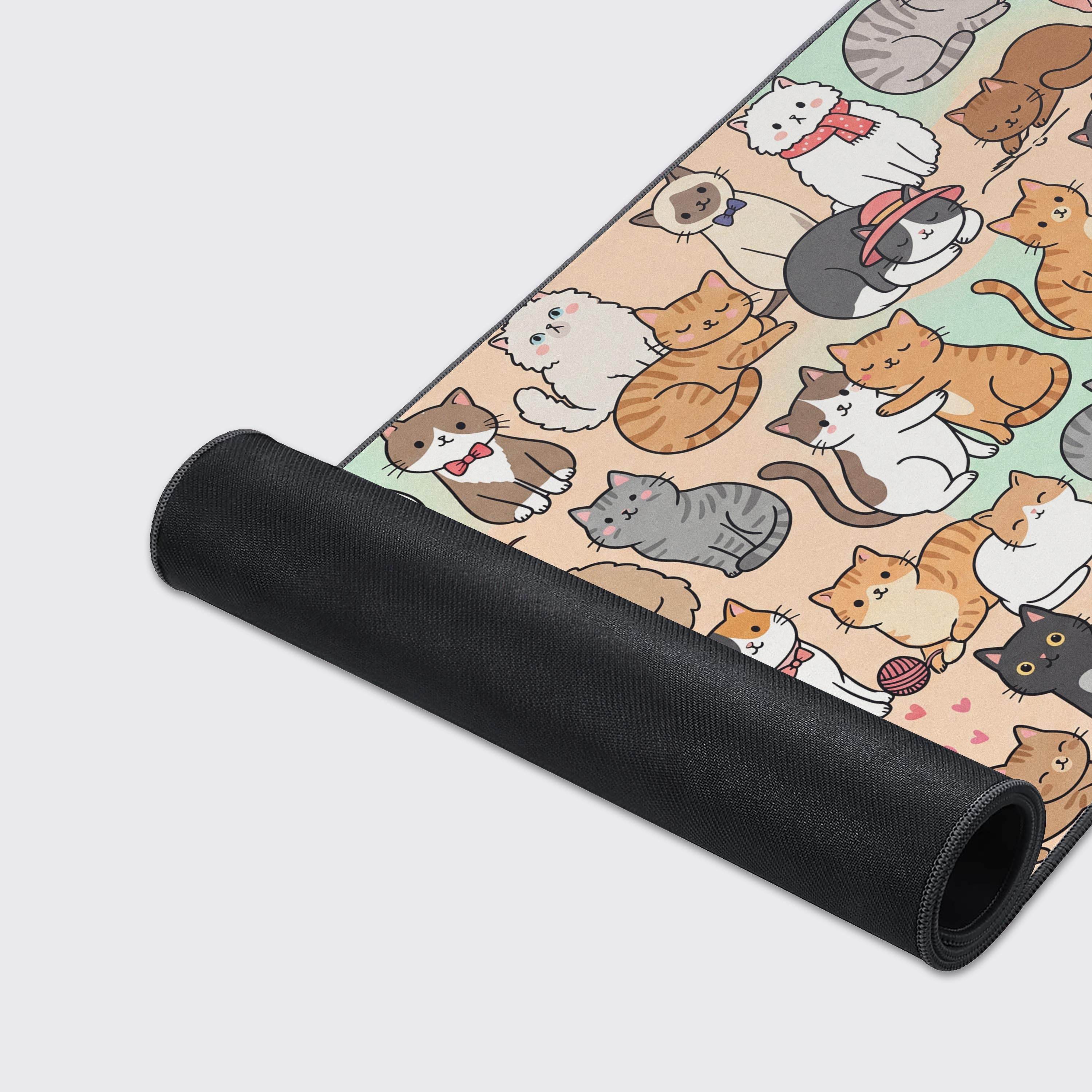 Product features of the cute cat desk mat highlighting non-slip base and waterproof surface.