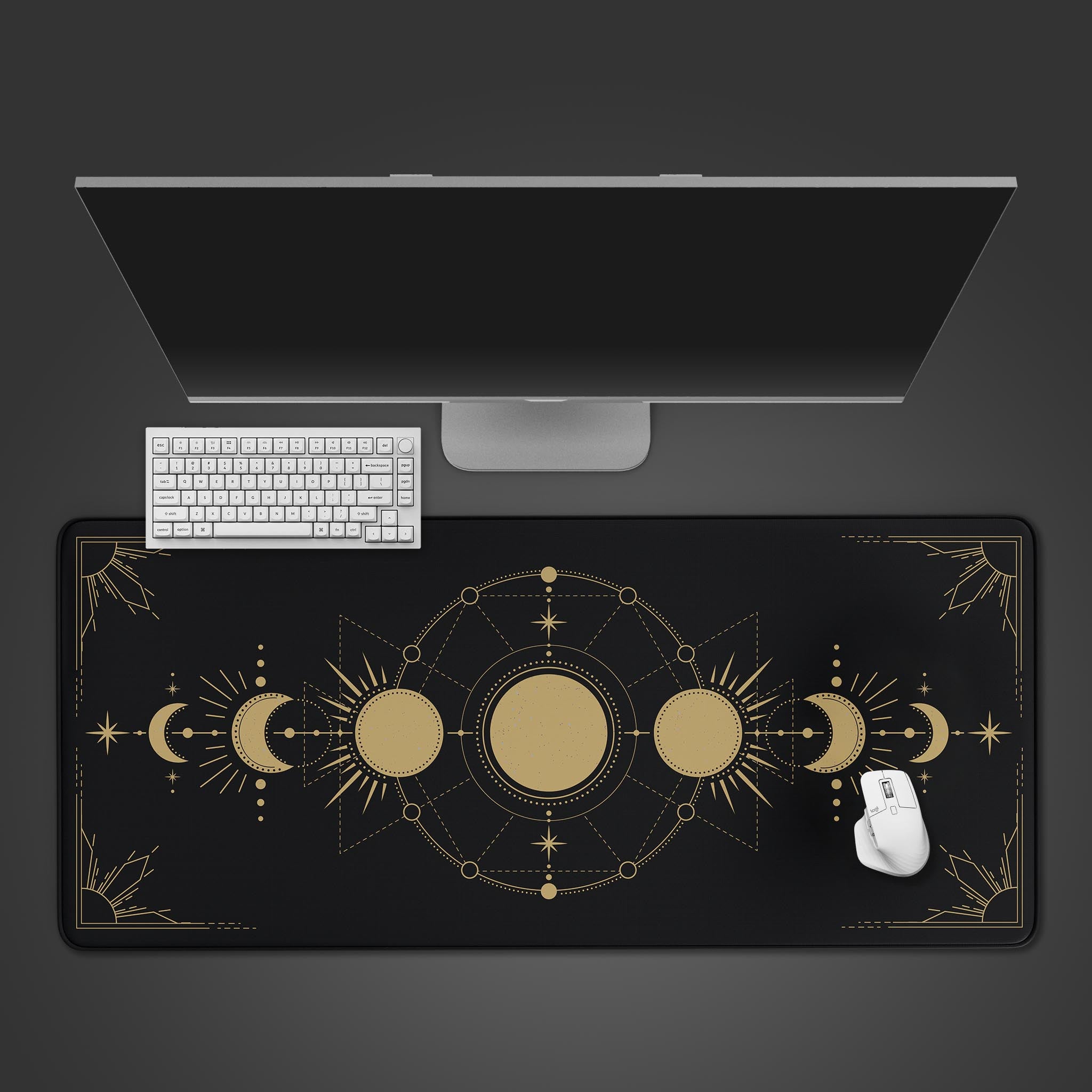 Celestial desk mat with gold astrology and moon phase design, shown from a top-down view on a desk with a black keyboard and mouse. - Epic Design Pads & Mousepads