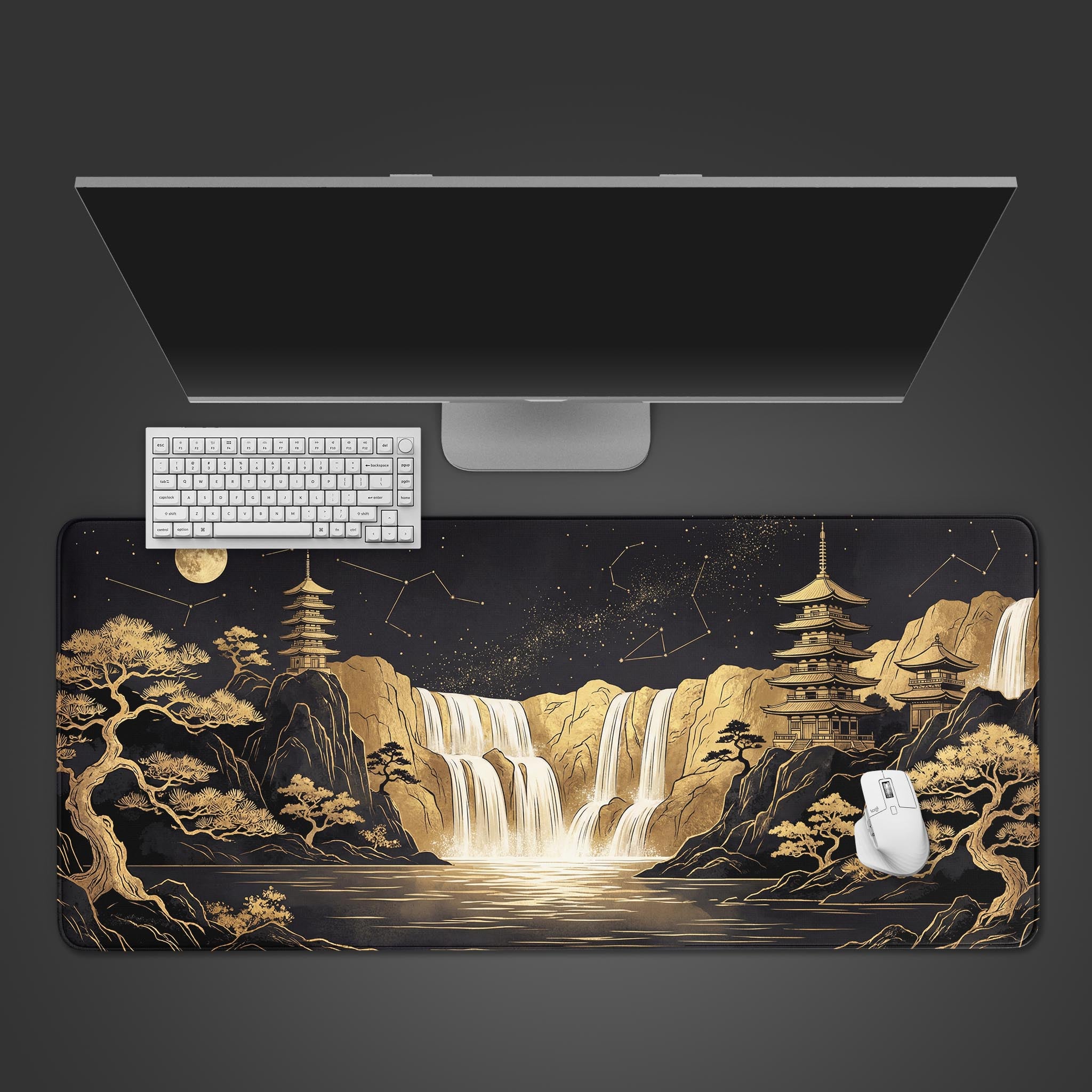 A top-down view of the Celestial Temple gaming desk mat, featuring a golden Japanese landscape. A white keyboard and mouse are placed on the mat below a sleek monitor. - Epic Design Pads & Mousepads