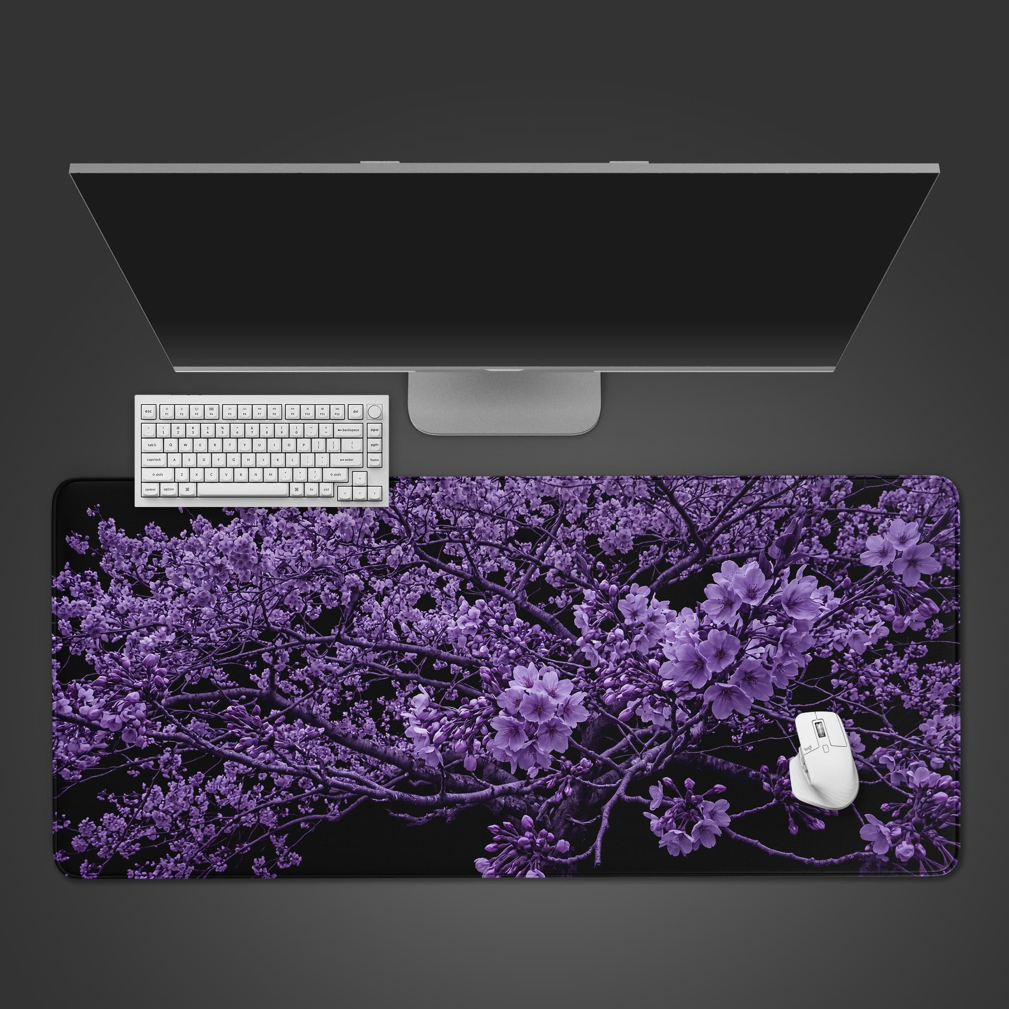 Amethyst Sakura desk mat showcasing vivid purple cherry blossoms on a black background