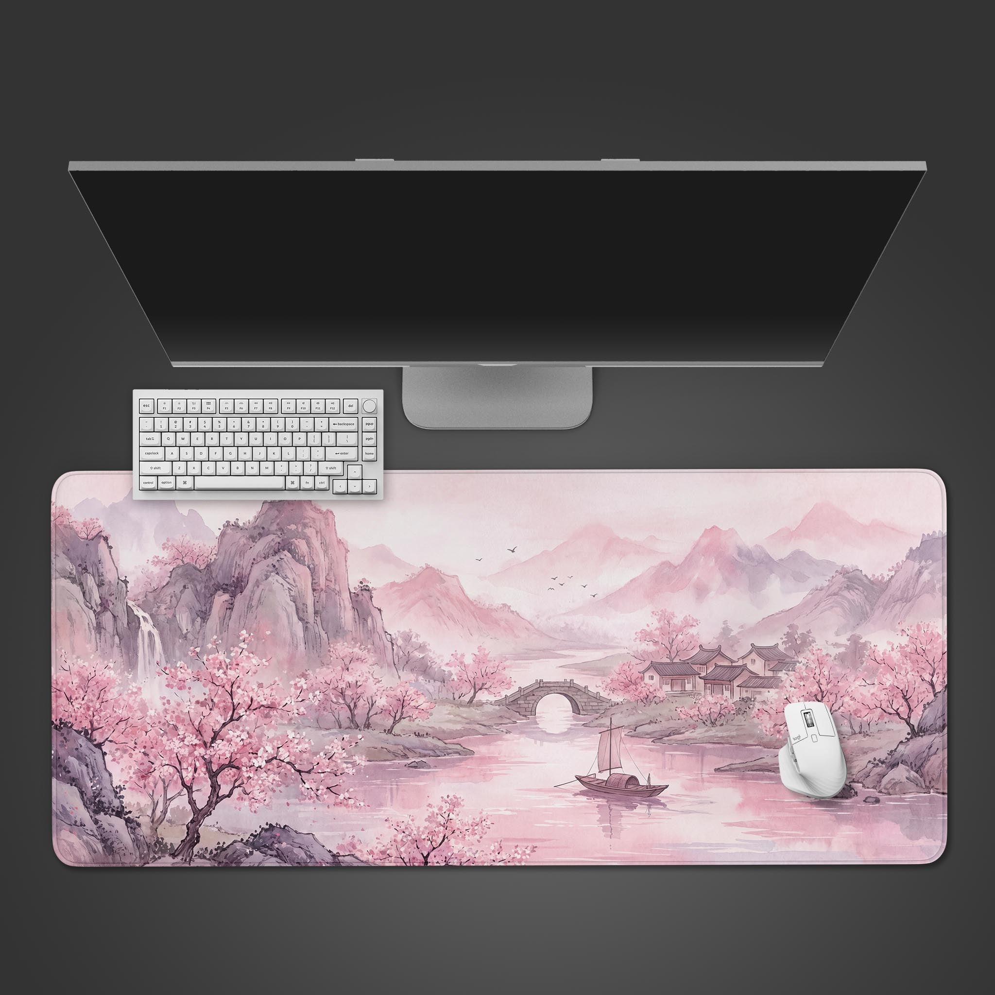 Serene pink watercolor landscape desk mat featuring cherry blossoms, mountains, and a river boat.