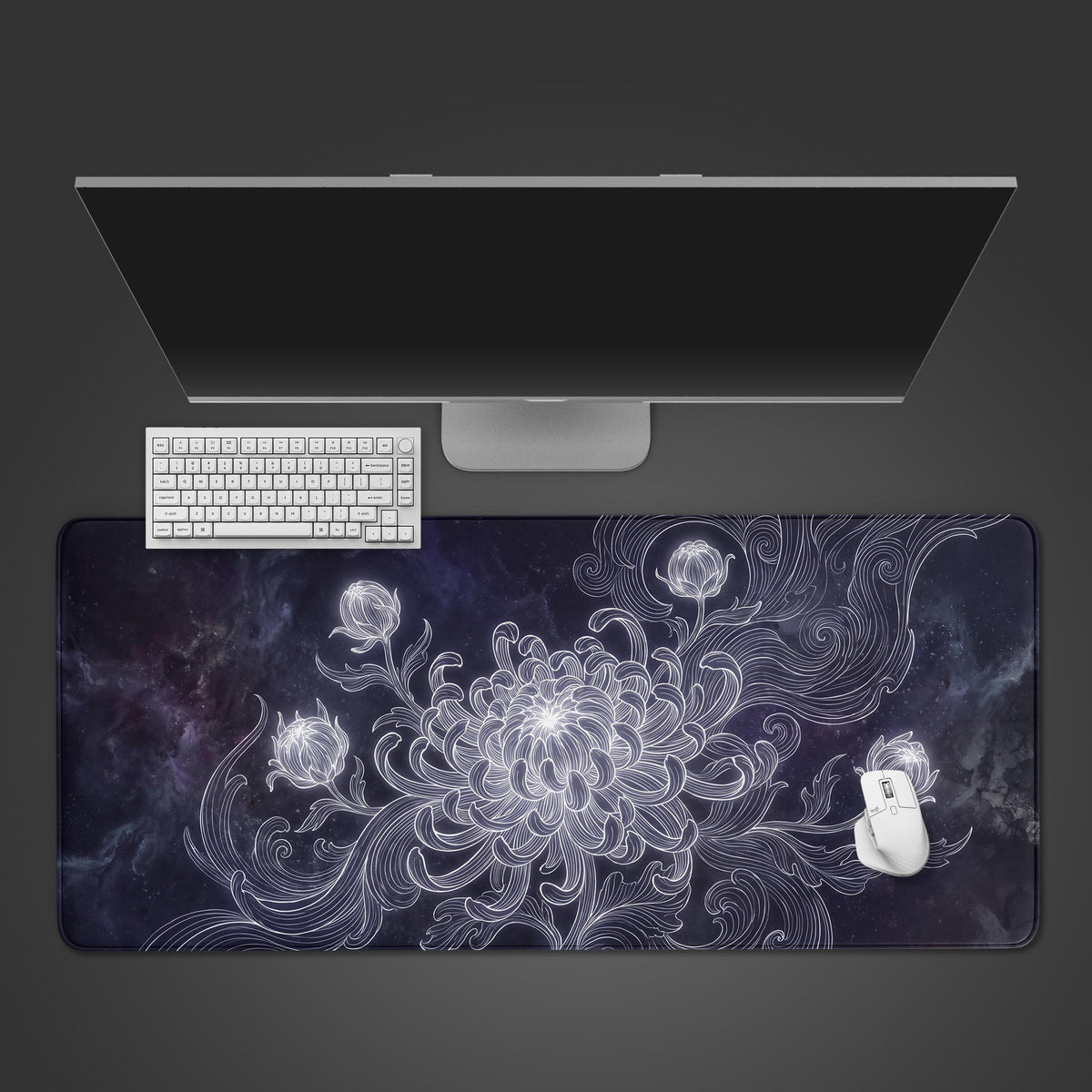A desk mat featuring a glowing white line-art chrysanthemum blooming against a dark cosmic nebula background.