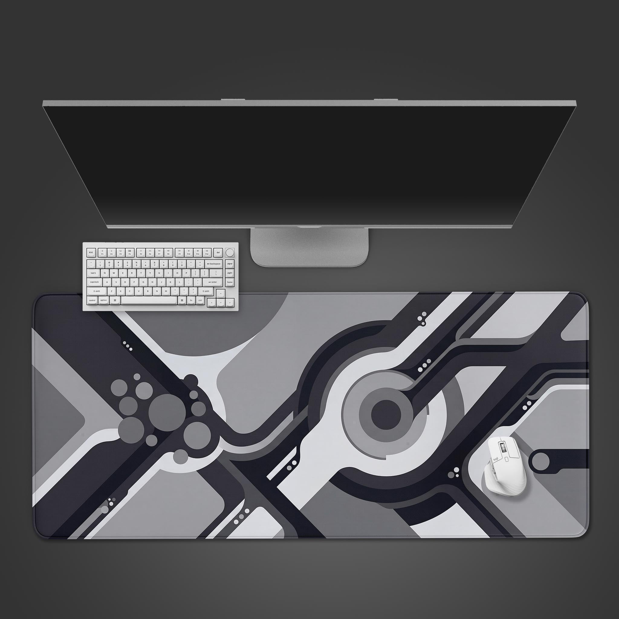 Monochrome abstract circuit board design on a large gaming desk mat.