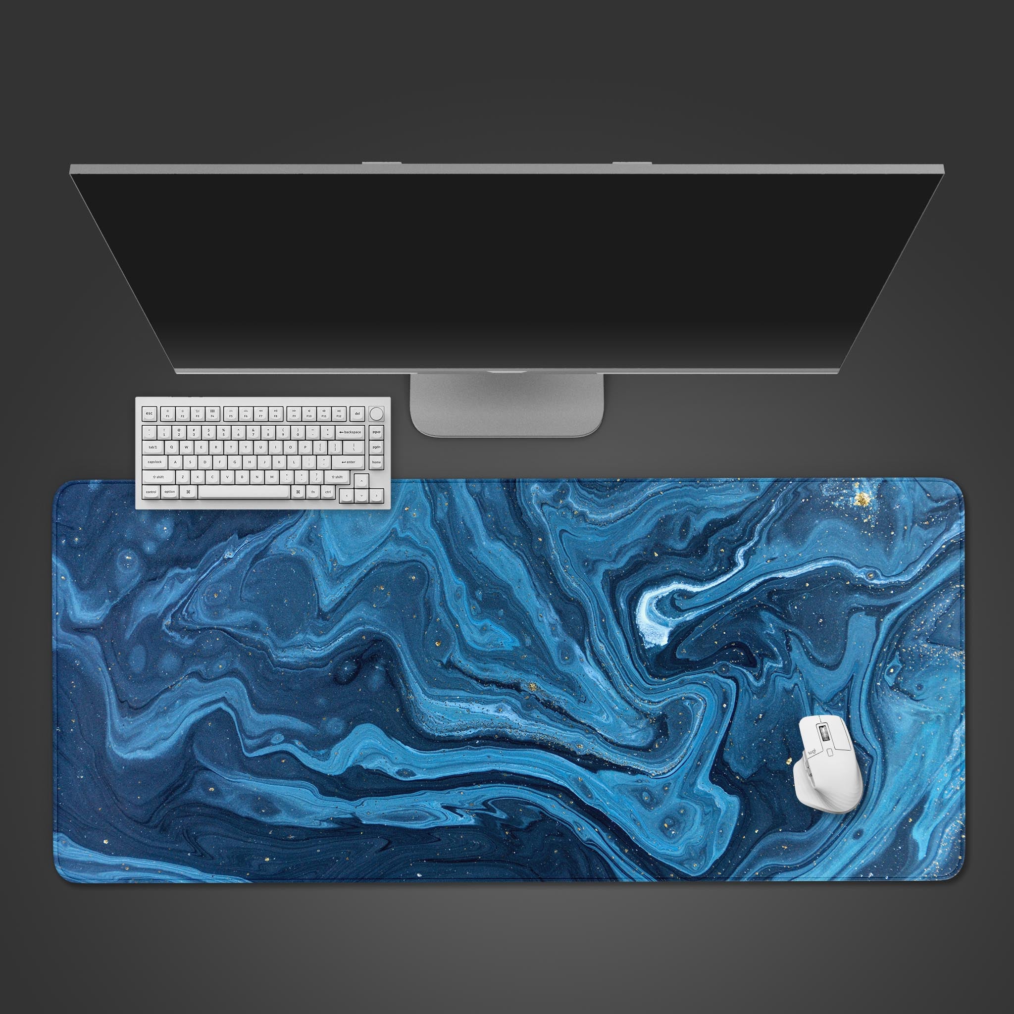 Cosmic Ocean desk mat with deep blues and ethereal streaks – top view with keyboard and mouse. - Epic Design Pads
