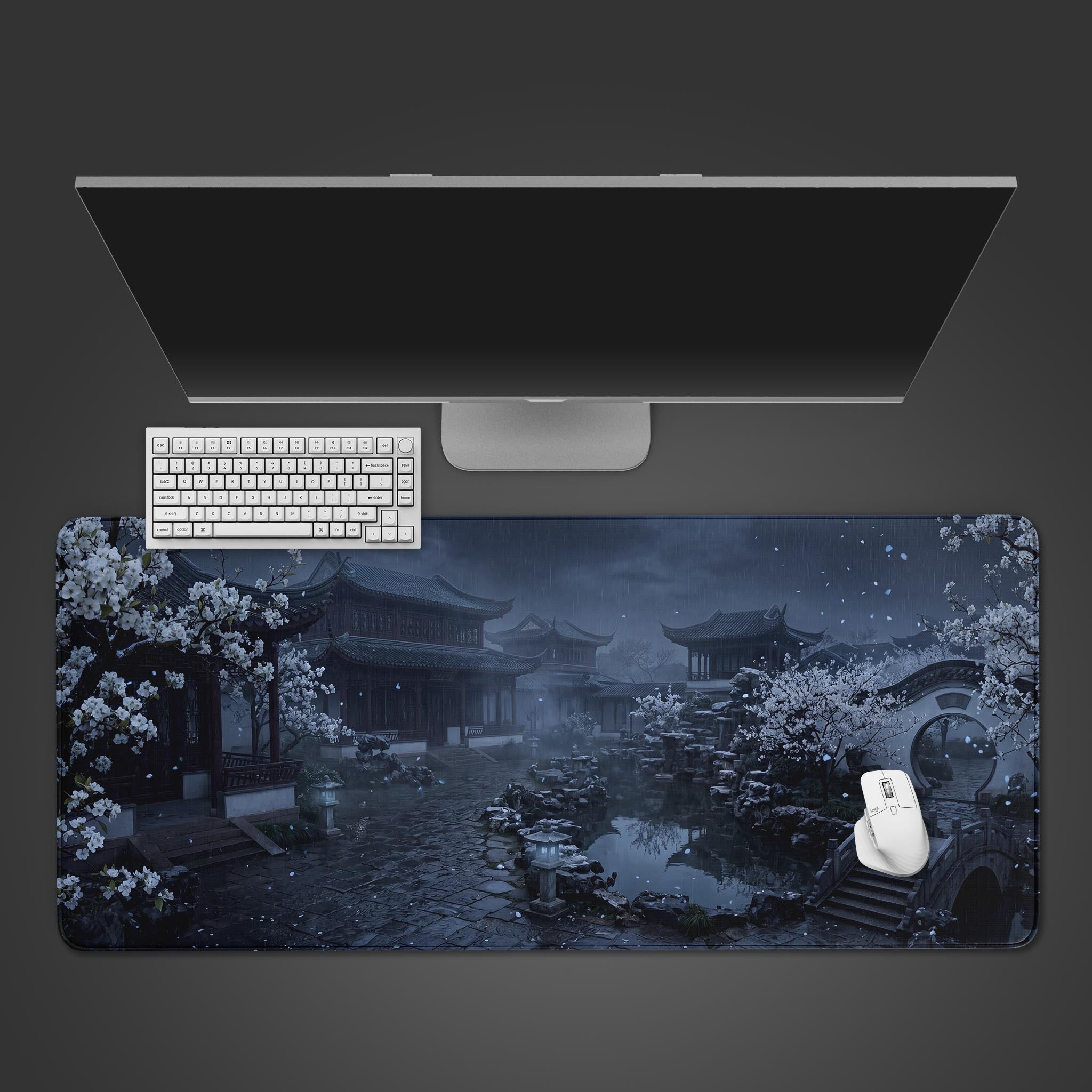 A dark moody desk mat featuring a traditional Chinese garden at night with white blossoms and a stone bridge.
