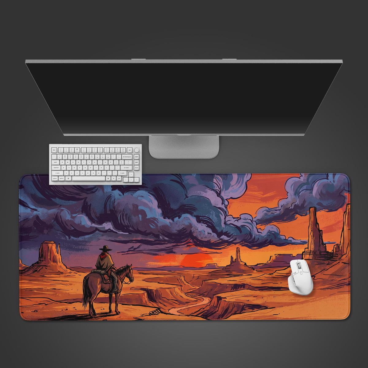 A desk mat featuring a retro comic book style illustration of a lone cowboy on horseback looking over a vast orange desert canyon under dramatic purple and blue sunset clouds.