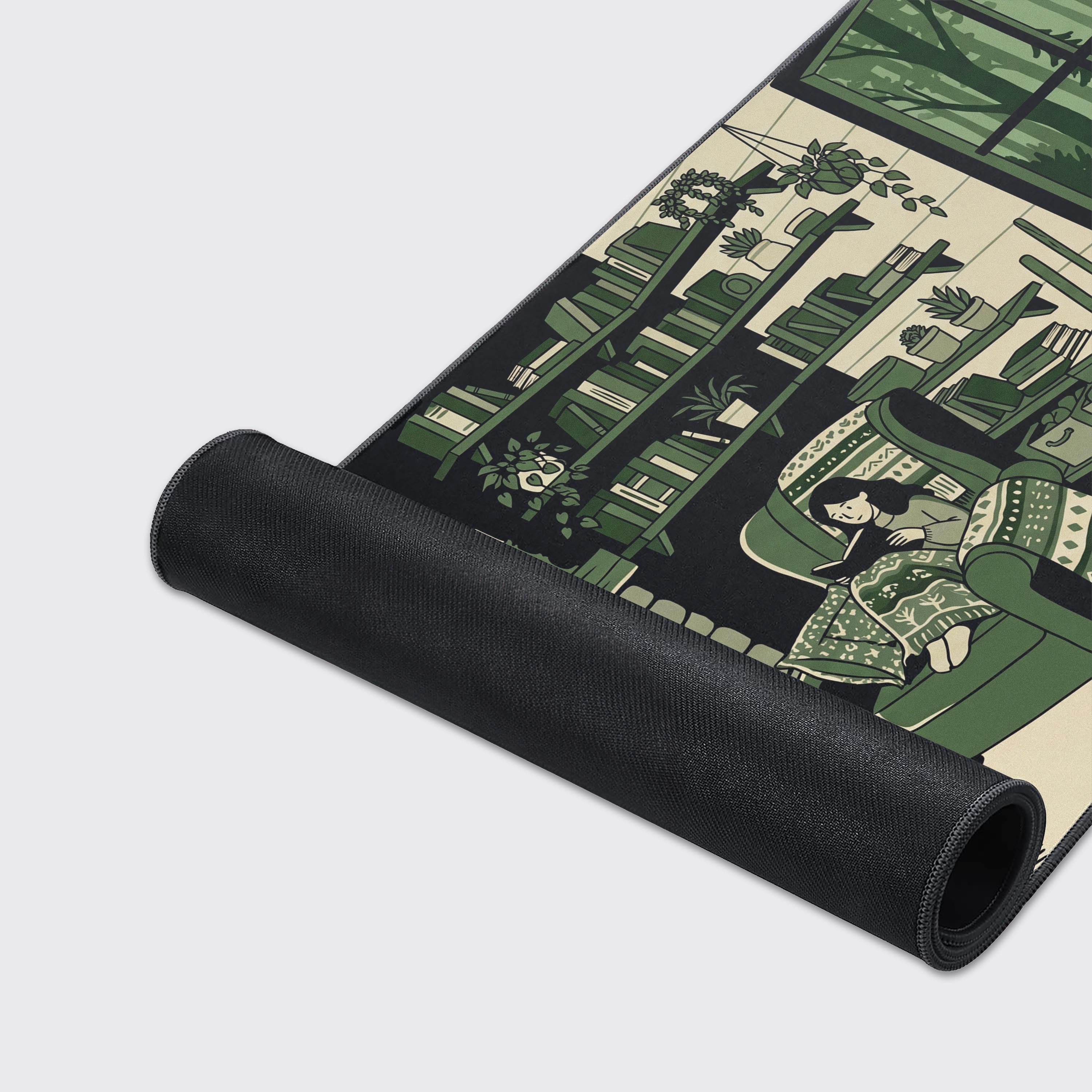 Flat lay of the calming green woodland aesthetic desk mat showing a forest view out the window