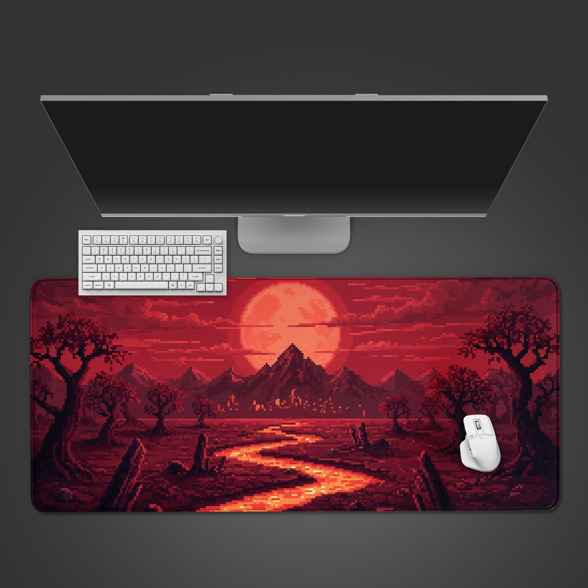 Crimson Pixelscape pixel art desk mat with red moon landscape – top-down view with a gaming keyboard and mouse. - Epic Design Pads