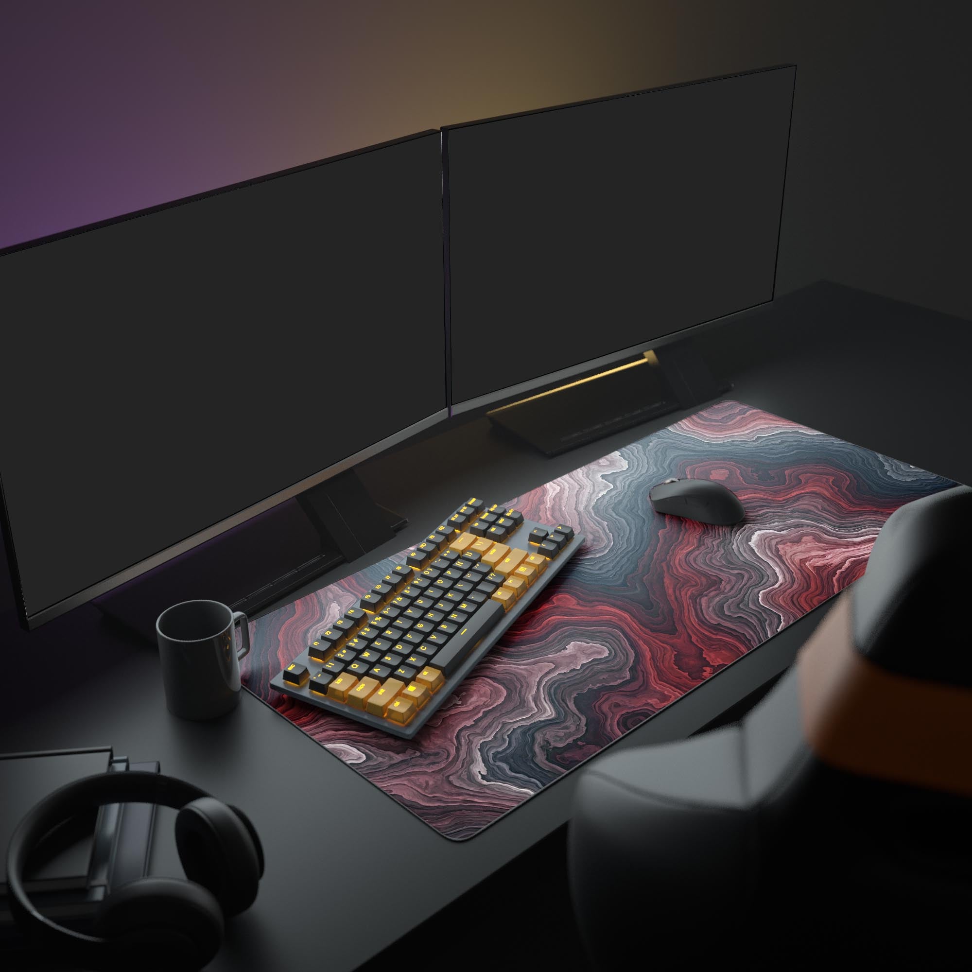 The Crimson Strata gaming desk mat enhancing a modern PC setup, providing a large, stylish surface for a glowing keyboard and mouse under a wide monitor. - Epic Design Pads & Mousepads