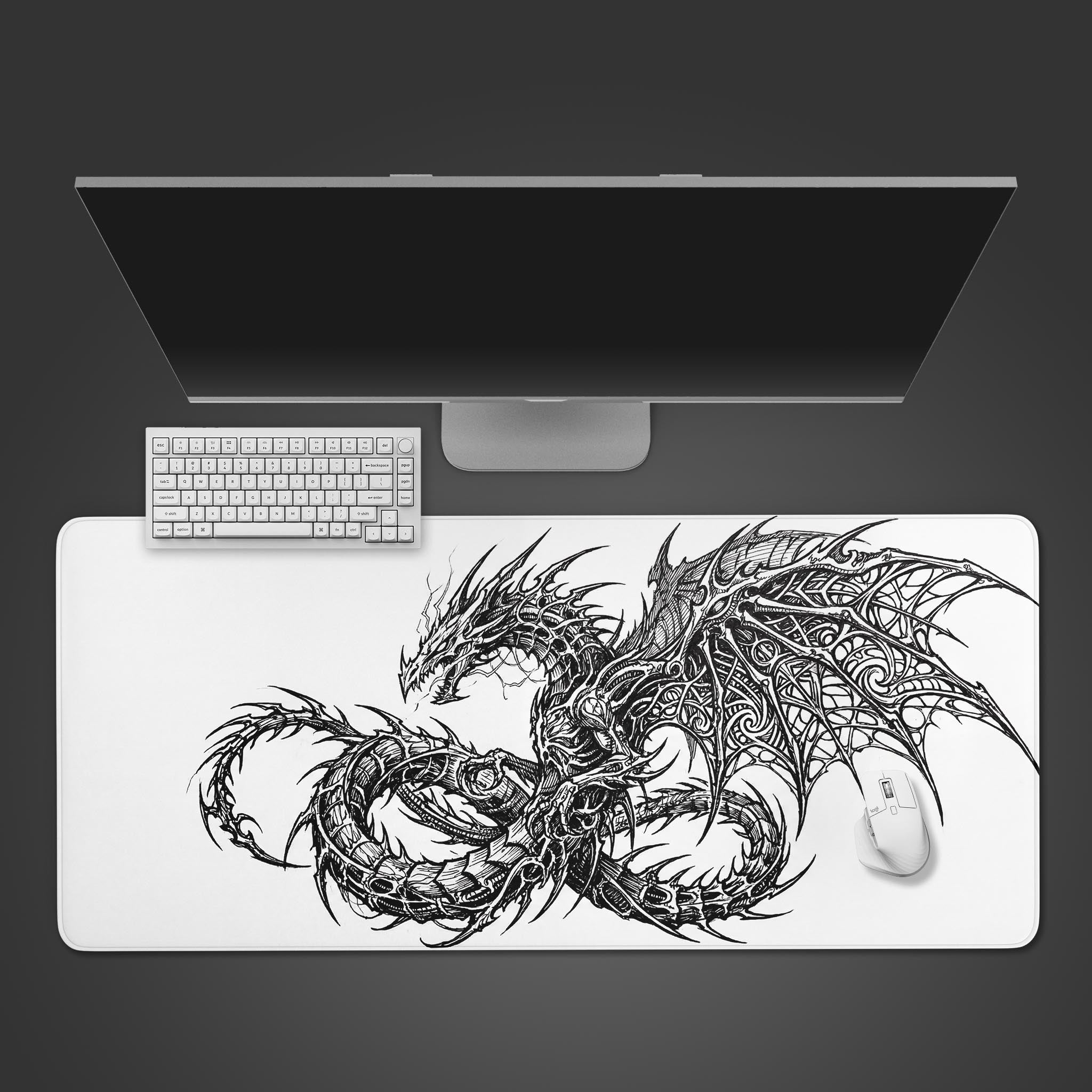 A top-down view of the Cyber Wyrm gaming desk mat, showcasing its intricate black dragon design alongside a white keyboard and mouse on a dark surface. - Epic Design Pads & Mousepads