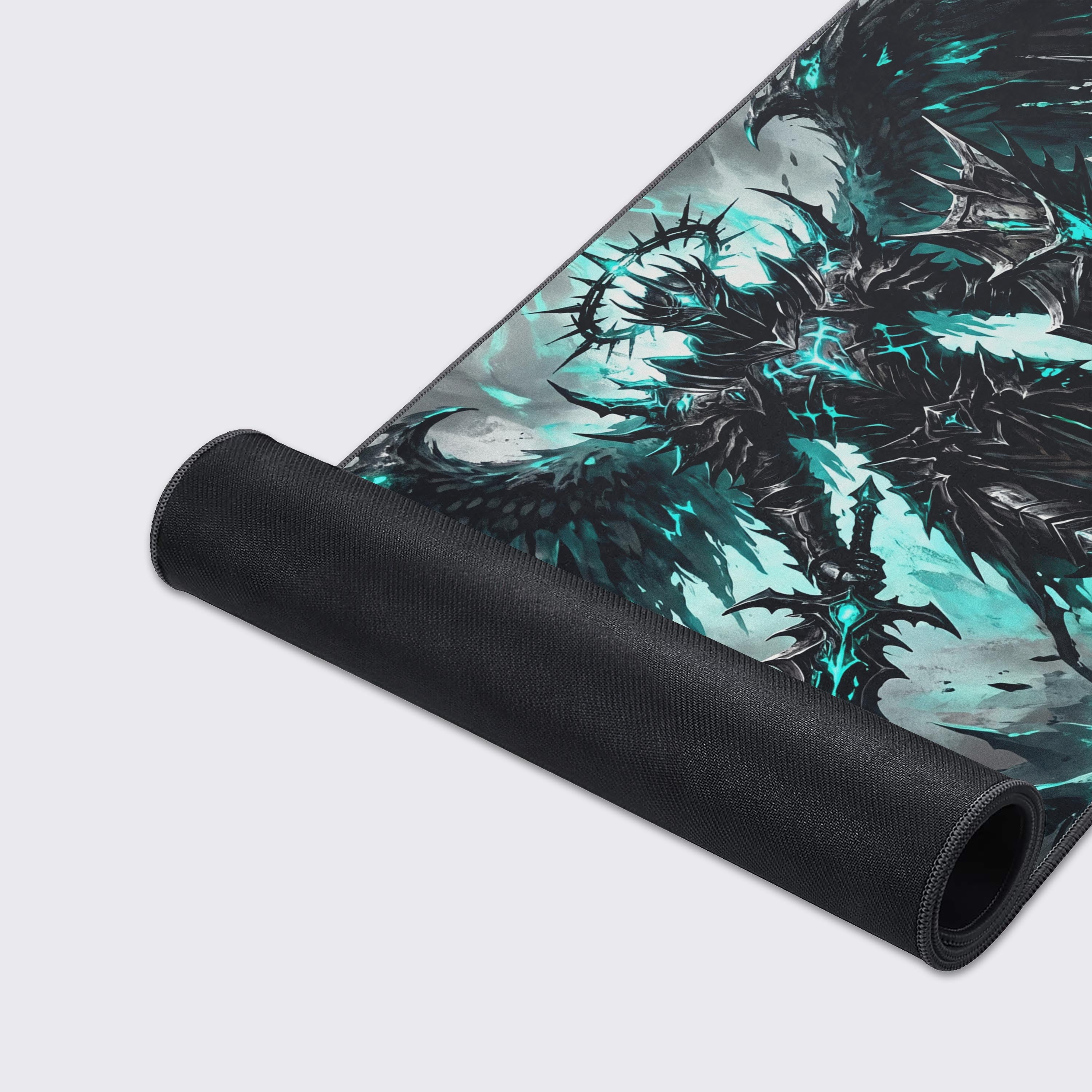 Detail view of the desk mat artwork highlighting intense cyan energy contrasting with dark gothic armor.