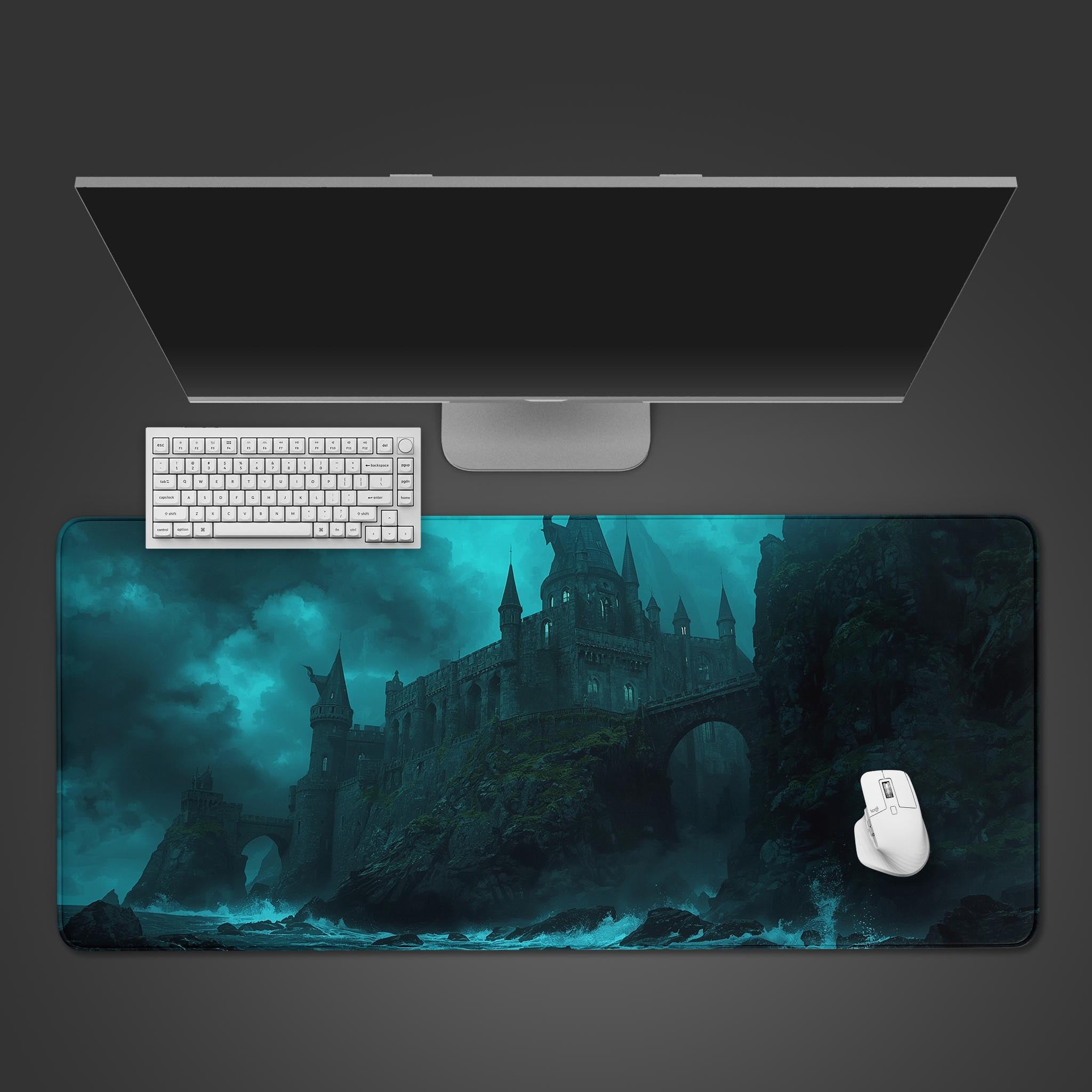 Dark Citadel gothic fantasy desk mat featuring a stormy castle scene, shown from a top-down view with a black keyboard and mouse. - Epic Design Pads