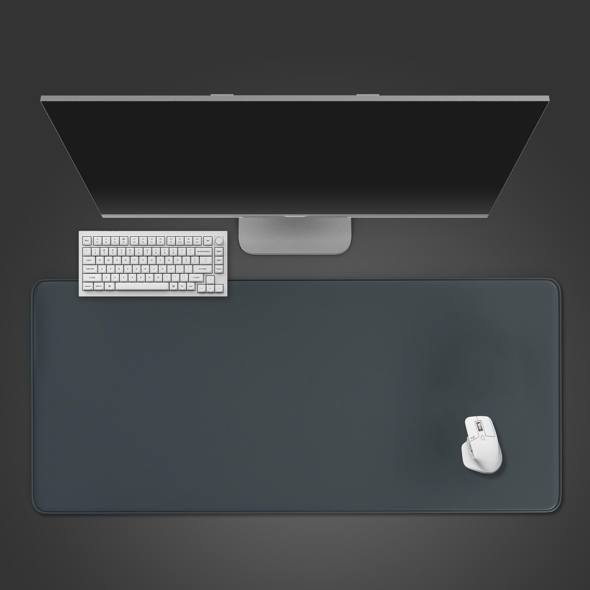 Top-down view of the Dark Gray gaming desk mat, providing a clean and minimalist workspace with a white keyboard and mouse. - Epic Design Pads & Mousepads