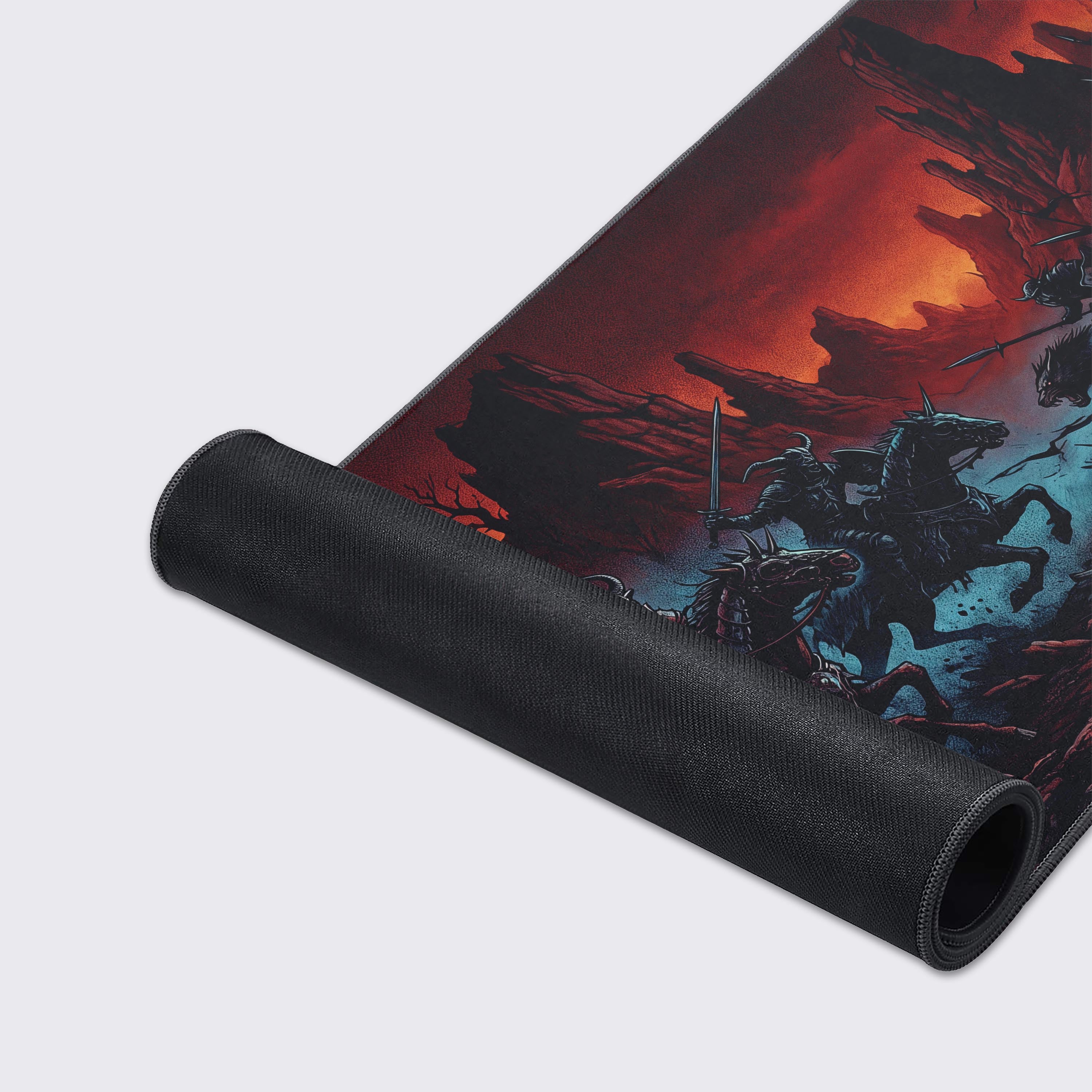 Wide view of the Infernal Charge XL desk mat highlighting the jagged rocks, barren trees, and intense crimson backdrop.