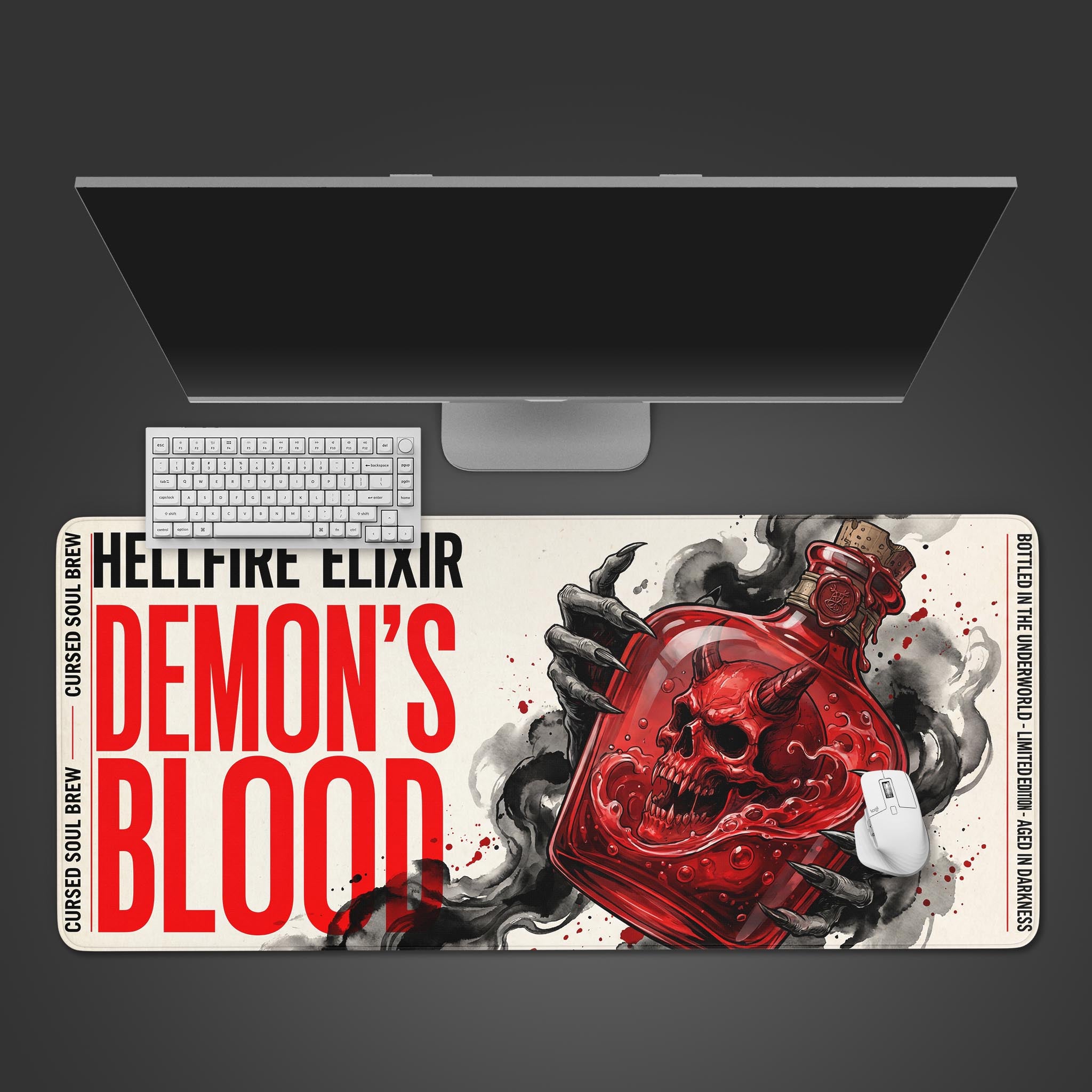 The Demon’s Blood gaming desk mat shown from above, with a white keyboard and mouse on its dark fantasy design featuring a red skull. - Epic Design Pads & Mousepads