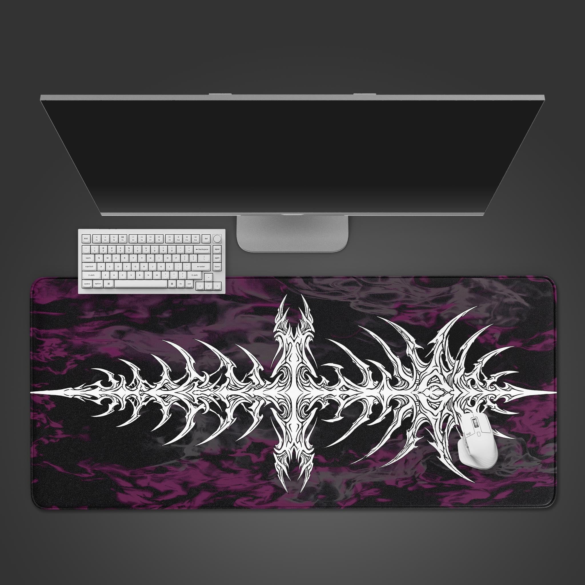 Top-down view of the Digital Vertebrae gaming desk mat featuring a white tribal sigil on a purple and black background, shown with a white keyboard and mouse. - Epic Design Pads & Mousepads