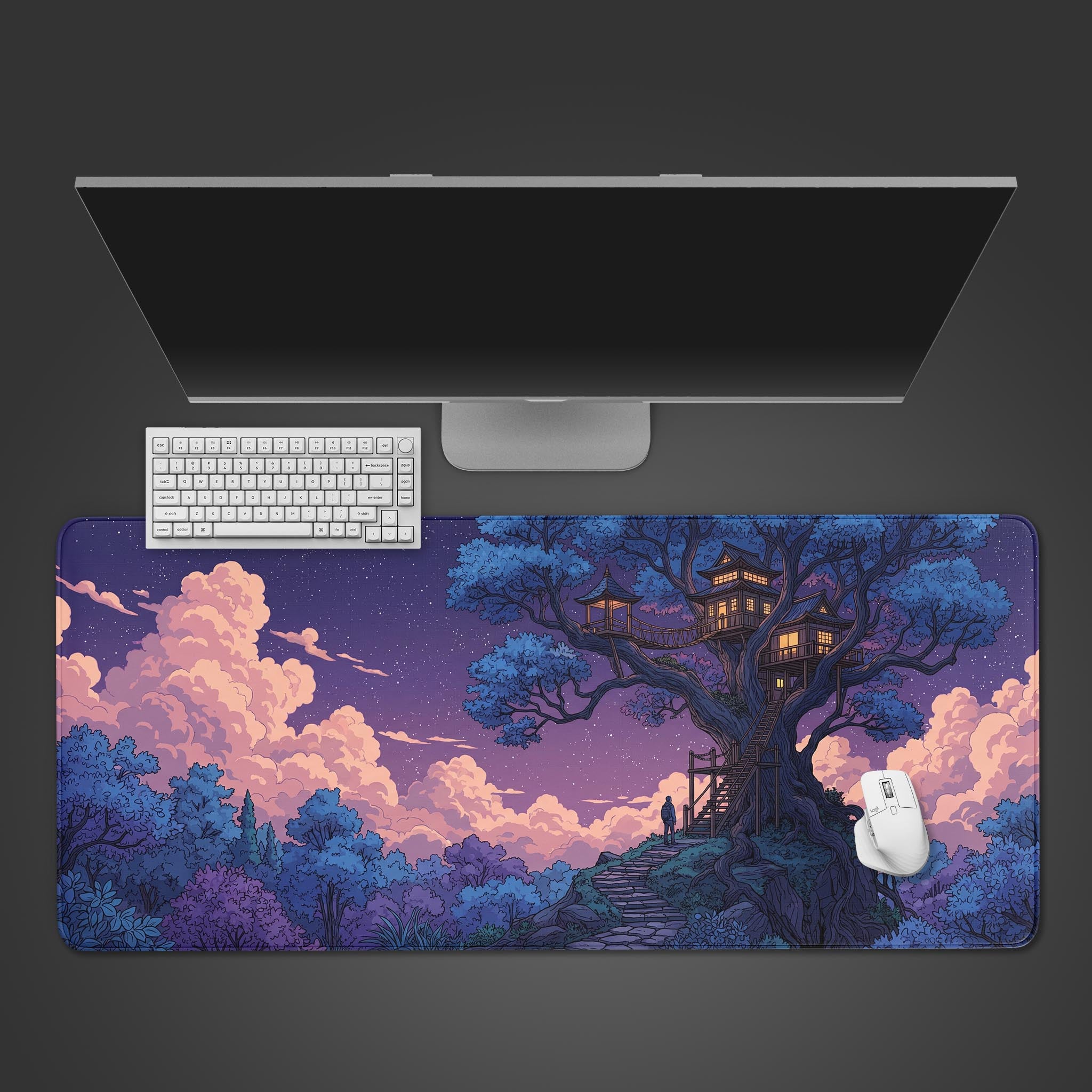 Top-down view of the Dreamer's Ascent gaming desk mat featuring a magical treehouse, shown with a white keyboard and mouse on a dark surface. - Epic Design Pads & Mousepads