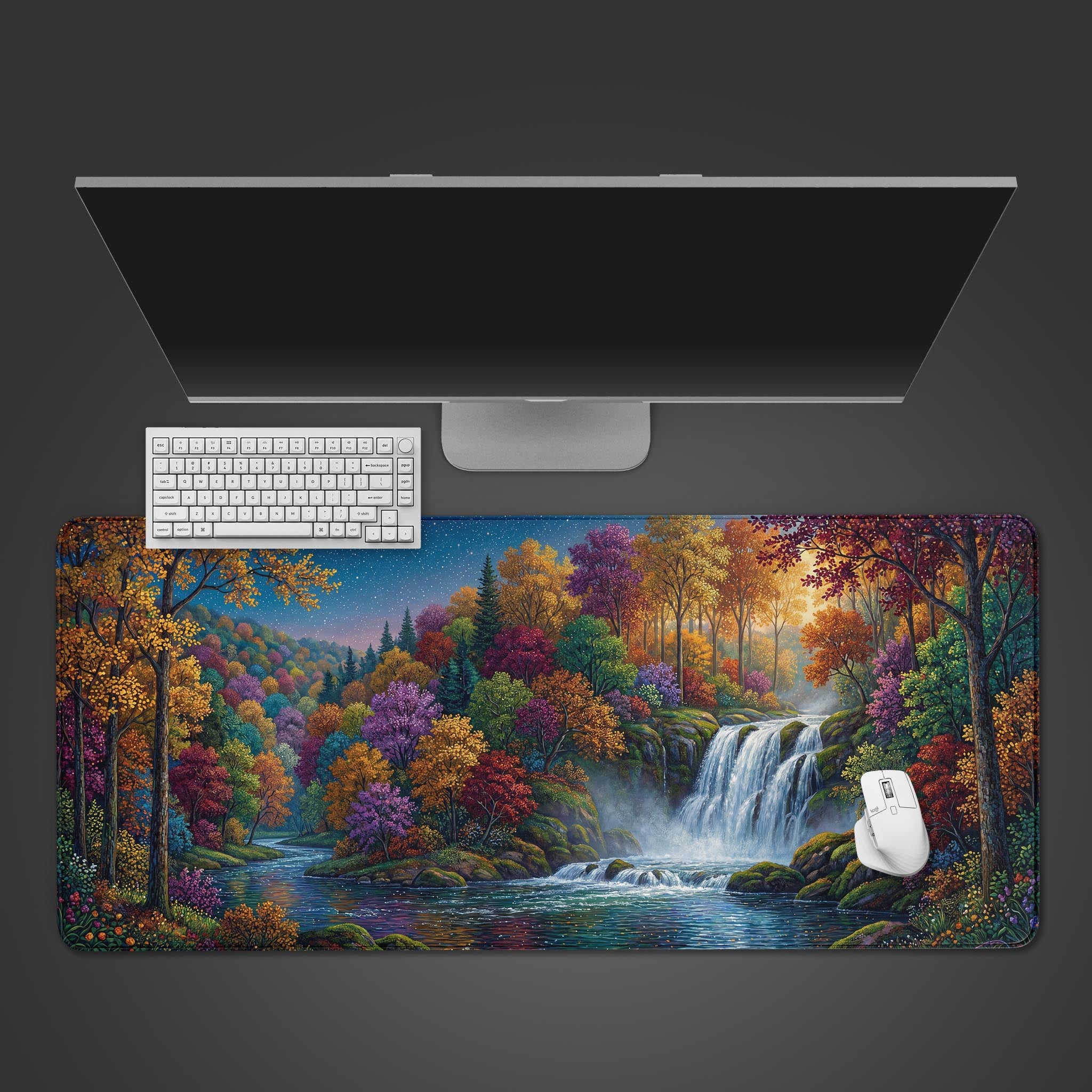 Enchanted Cascade desk mat featuring a vibrant, colorful forest and waterfall.