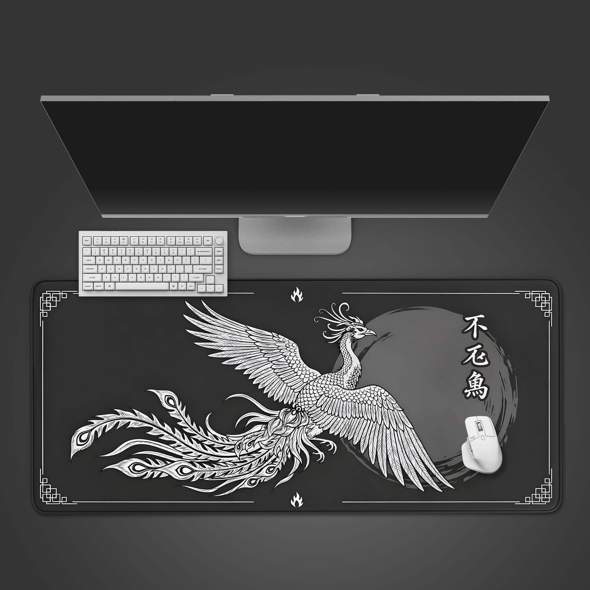 Eternal Phoenix desk mat in monochrome Japanese ink wash style. Top-down view on a desk with a black keyboard and white mouse. - Epic Design Pads