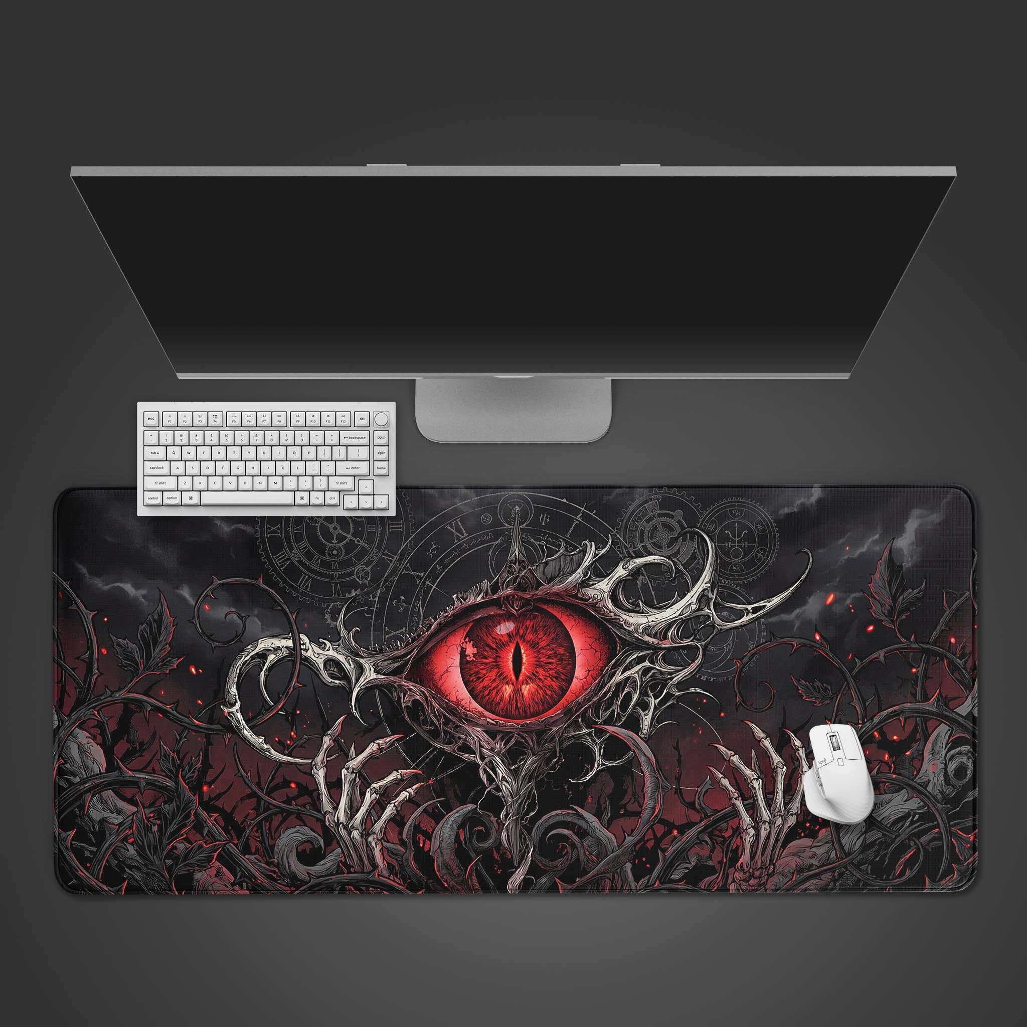 The Eye of Judgment gaming desk mat from a top-down view, featuring a white keyboard and mouse on its dark fantasy crimson eye design. - Epic Design Pads & Mousepads