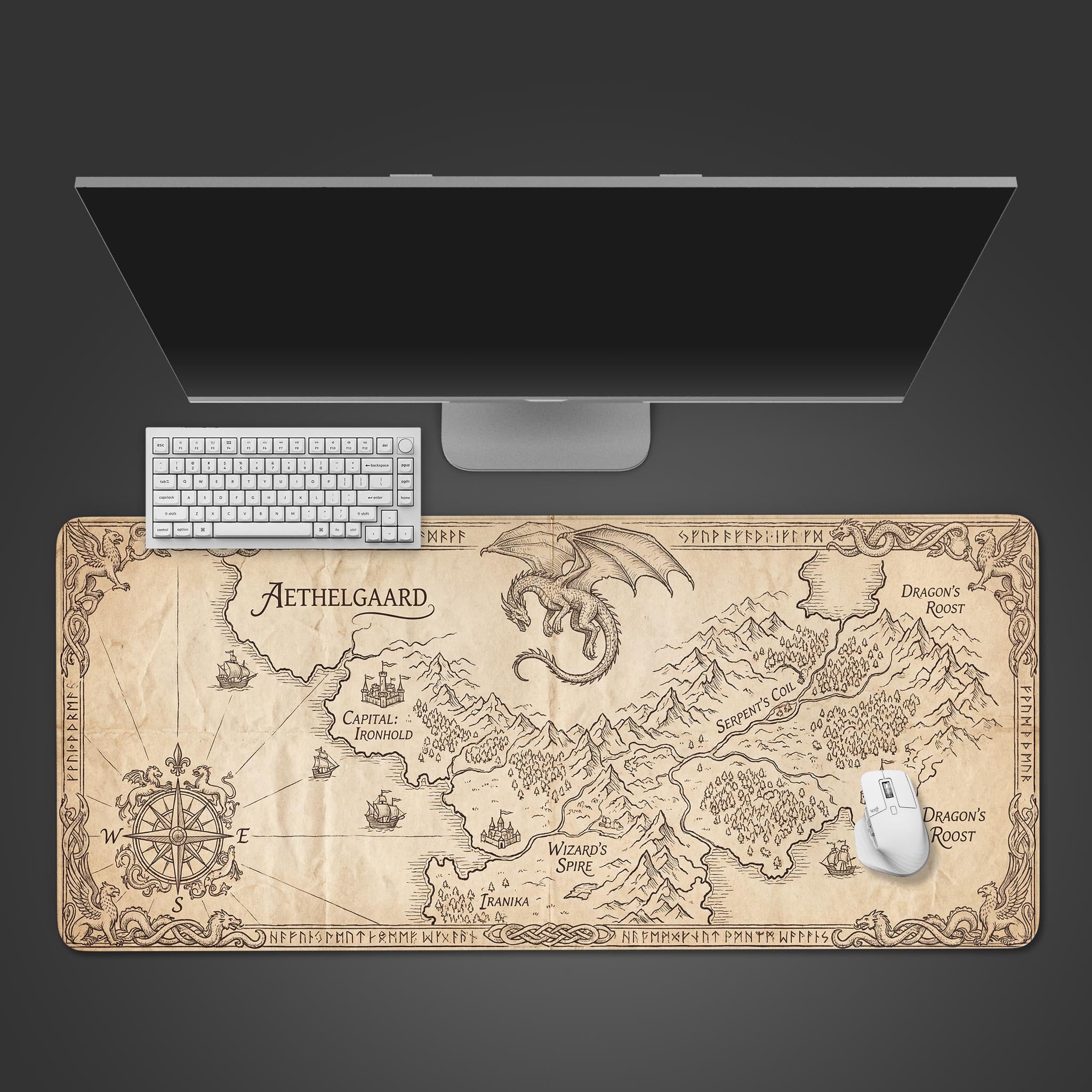 Fantasy Atlas map desk mat with vintage parchment design, shown top-down with a keyboard and mouse. - Epic Design Pads & Mousepads