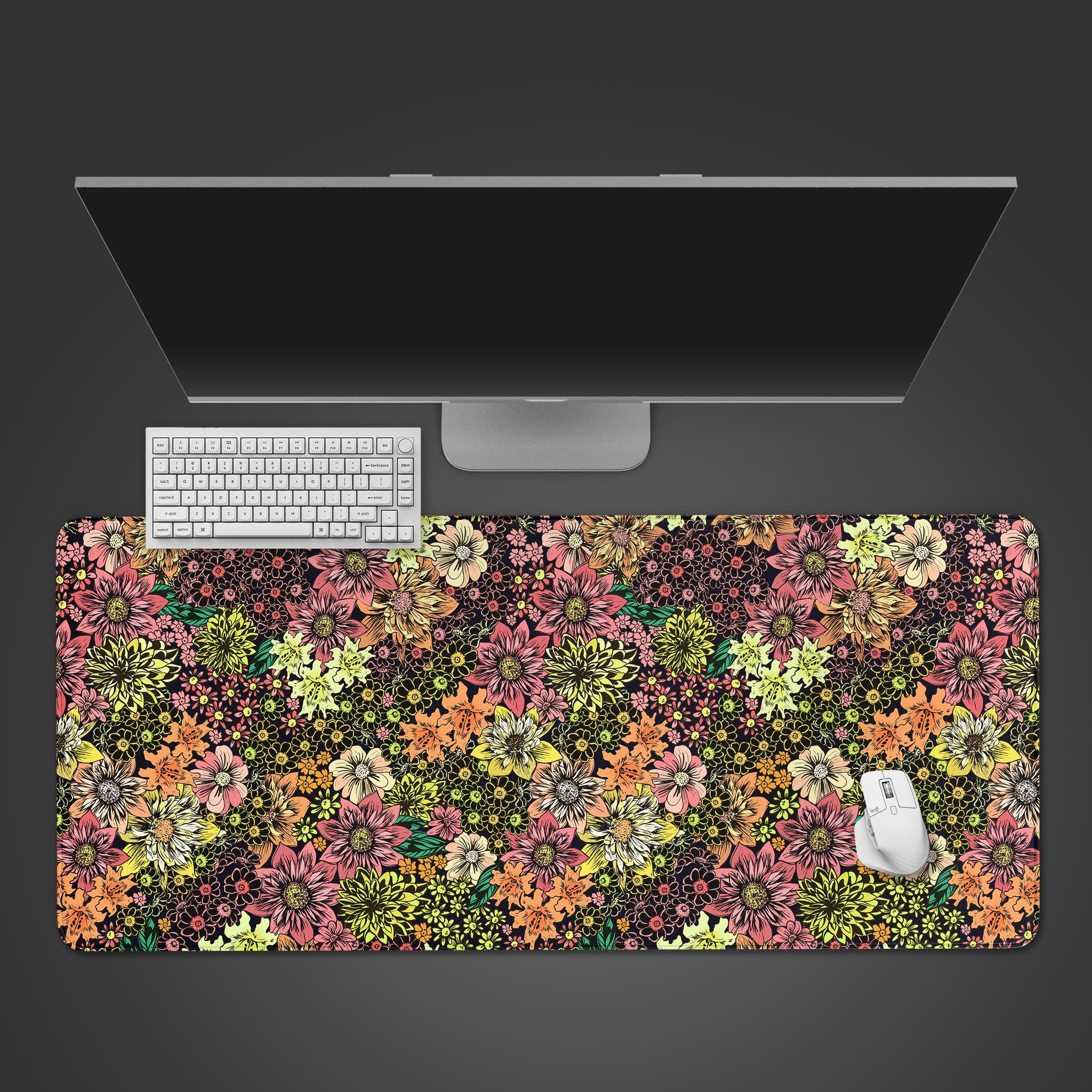 Floral Burst desk mat with a vibrant millefleur pattern, shown from a top-down desktop view with a white keyboard and mouse. - Epic Design Pads & Mousepads