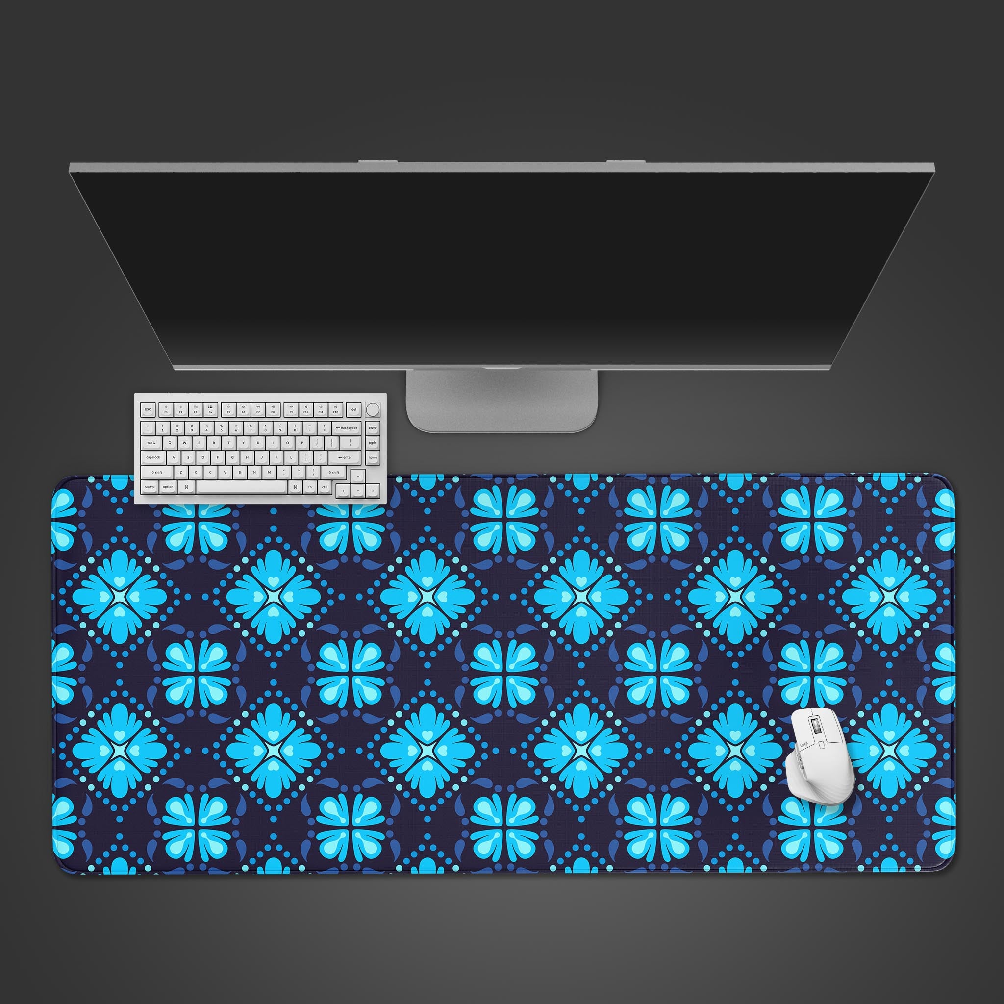 Floral desk mat with a blue geometric pattern on a navy background – desktop view with keyboard and mouse. - Epic Design Pads & Mousepads