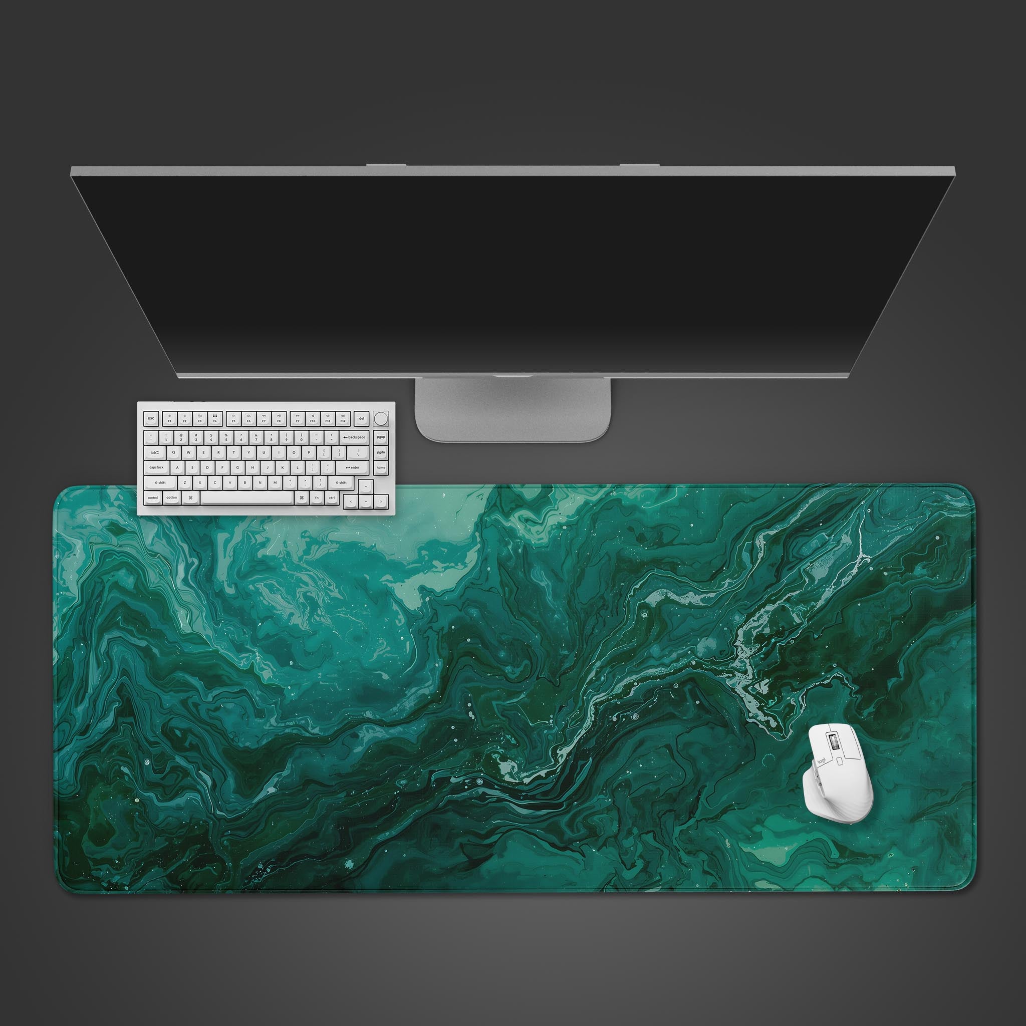 Emerald green fluid art desk mat with swirling marble patterns