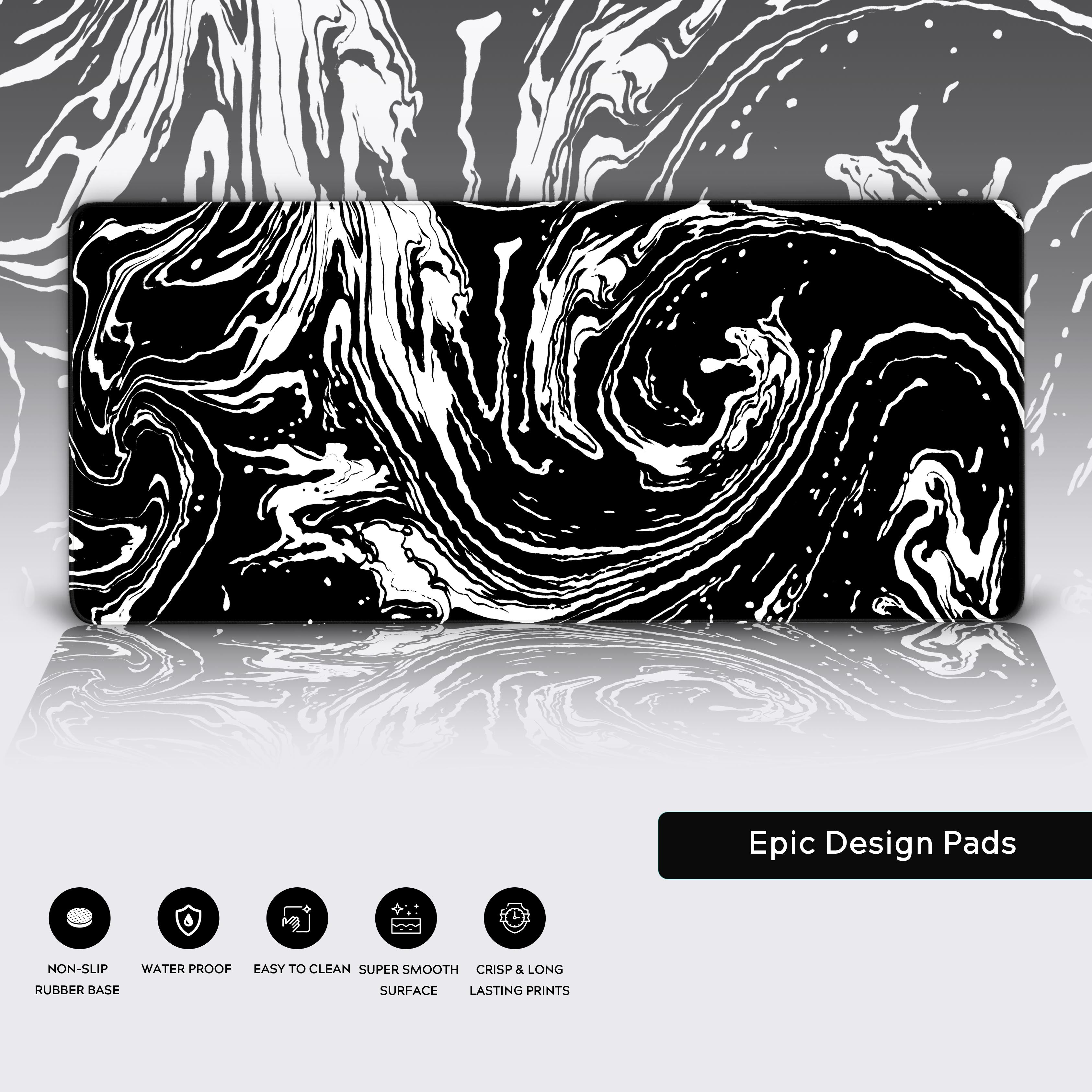 Angled view of the fluid art desk mat highlighting its smooth surface and striking monochromatic design.