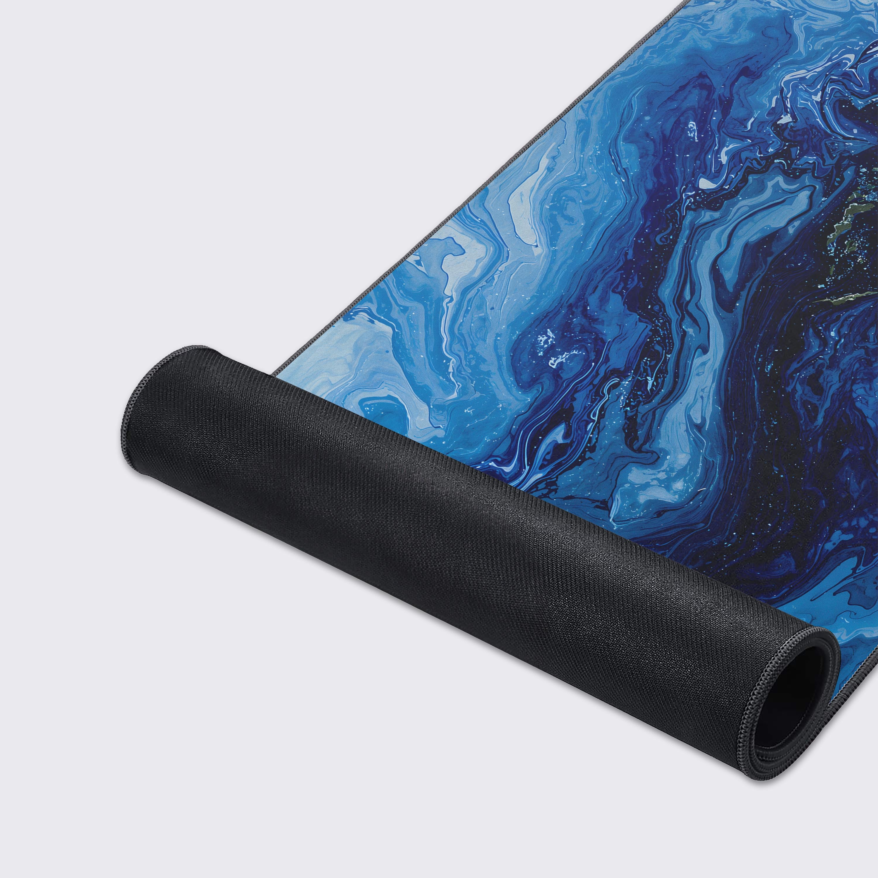 Features of the desk mat highlighting non-slip base, waterproof surface, and crisp prints