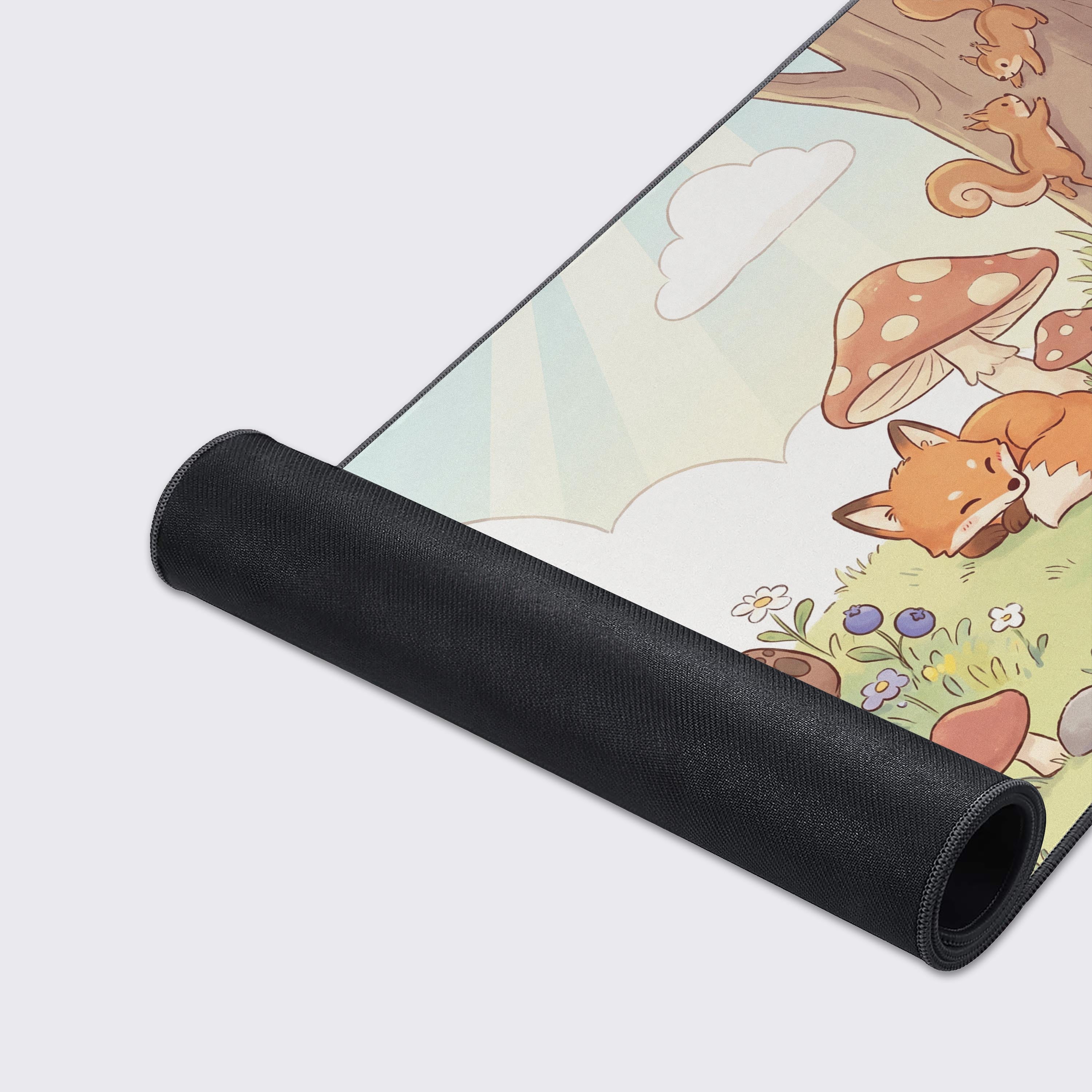 Detailed view of the studious owl and cute hedgehog holding an acorn on the high-quality desk pad.