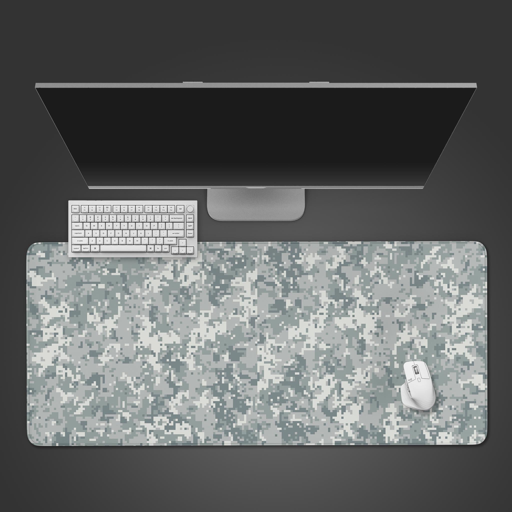 Frost Pixel Camo gaming desk mat with a white and grey digital pattern, shown from a top-down desktop view with a keyboard and mouse. - Epic Design Pads