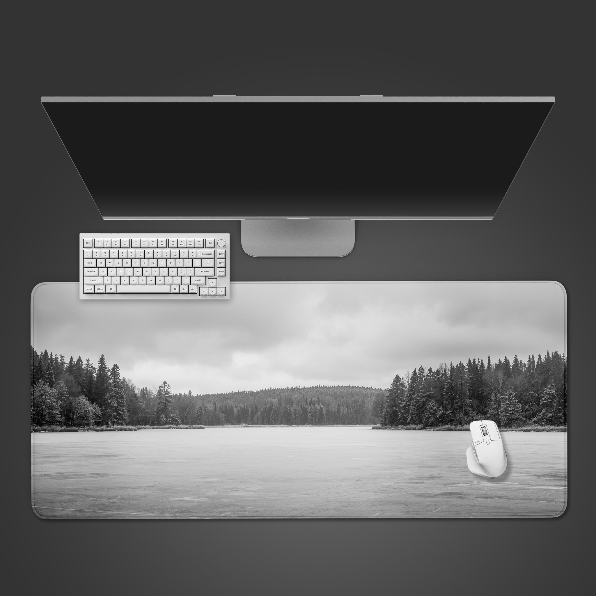 Frozen Lake desk mat in a minimalist black and white design – top-down desktop view with a sleek keyboard and mouse. - Epic Design Pads
