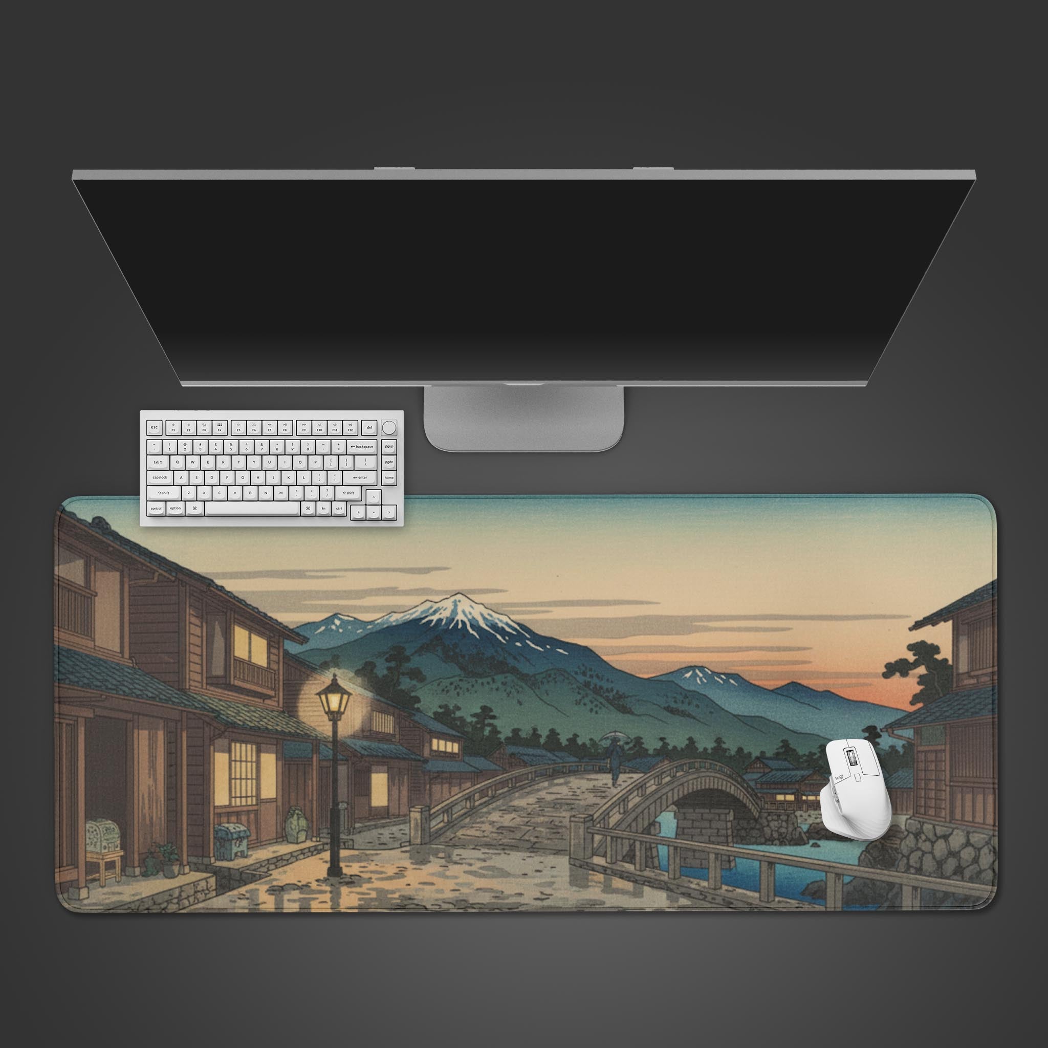 Fuji at Dusk Japanese art desk mat from a top-down view with a keyboard and mouse, showcasing the tranquil village and mountain design. - Epic Design Pads