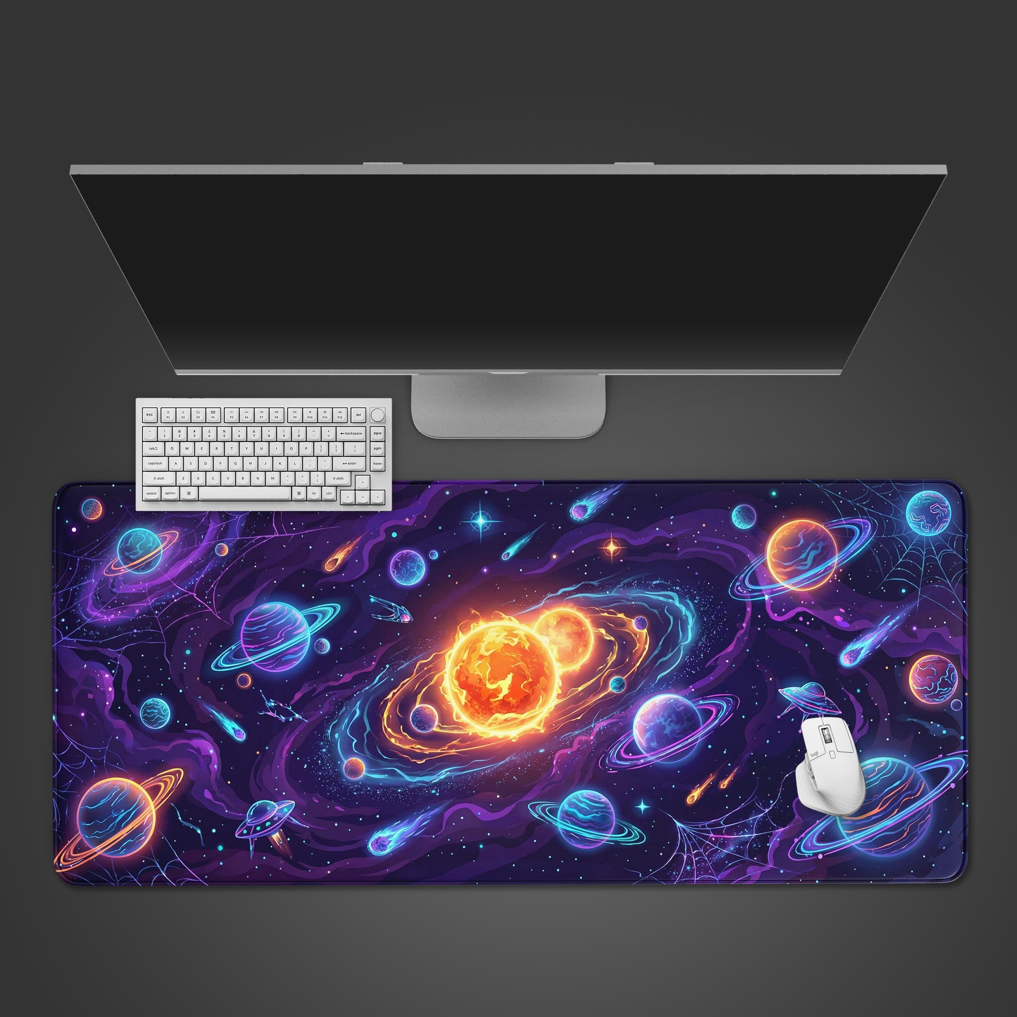 Top-down view of the Galactic Nexus gaming desk mat, showcasing its vibrant space design with planets and stars under a white keyboard and mouse. - Epic Design Pads & Mousepads