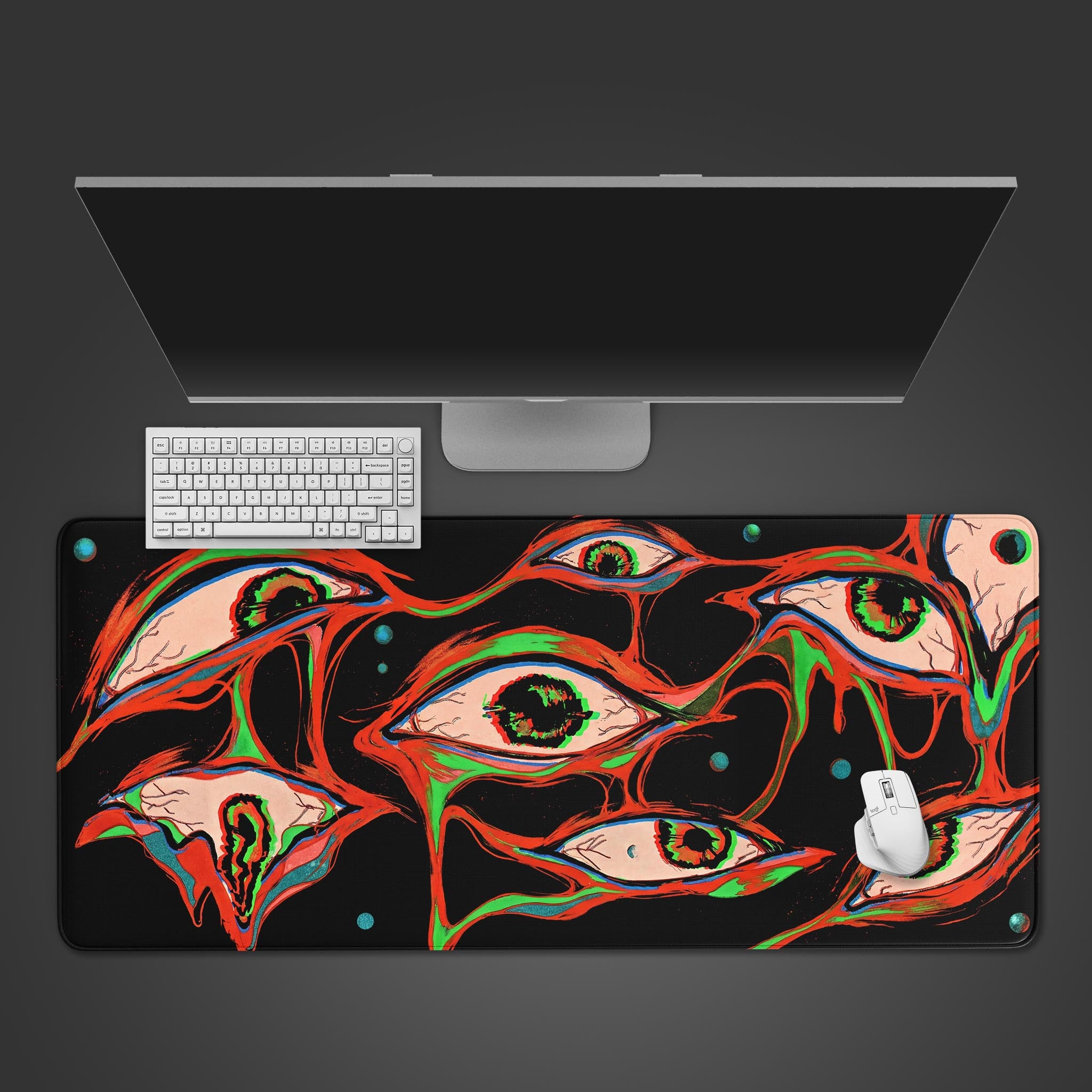 Top-down view of the Glitch Gaze Gaming Desk Mat featuring a surreal eye pattern, shown with a white keyboard and mouse on a dark surface. - Epic Design Pads & Mousepads