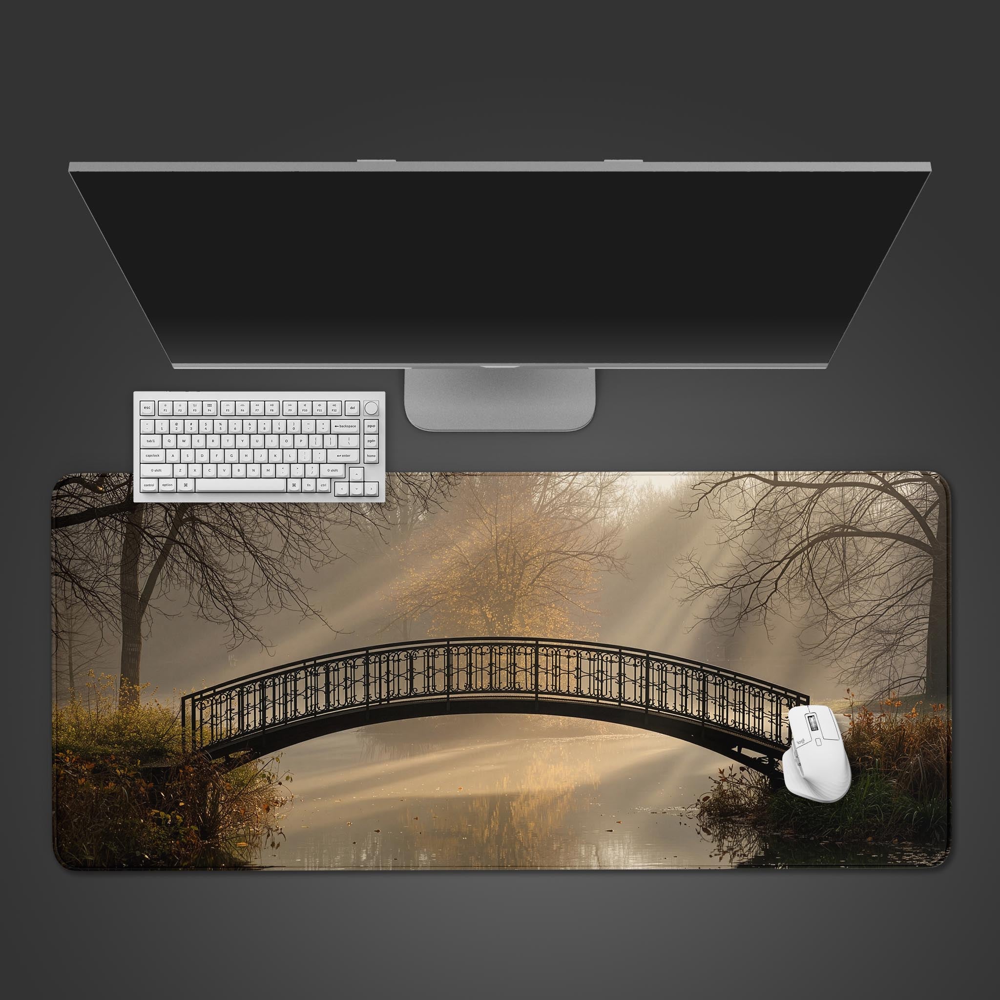 Golden Fog desk mat with autumn bridge landscape shown from a top-down view with a minimalist keyboard and mouse. - Epic Design Pads