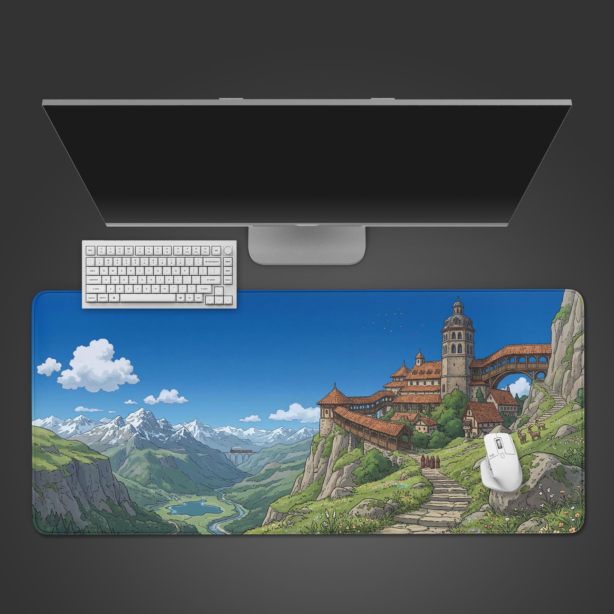 Top-down view of the Highland Escape Gaming Desk Mat featuring a scenic mountain village, shown with a white keyboard and mouse on a dark background. - Epic Design Pads & Mousepads