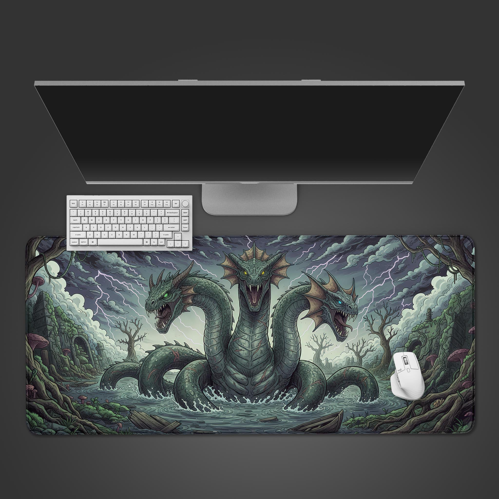 Hydra's Fury gaming desk mat featuring a three-headed serpent. Top-down view on a desk with a black mechanical keyboard and gaming mouse. - Epic Design Pads