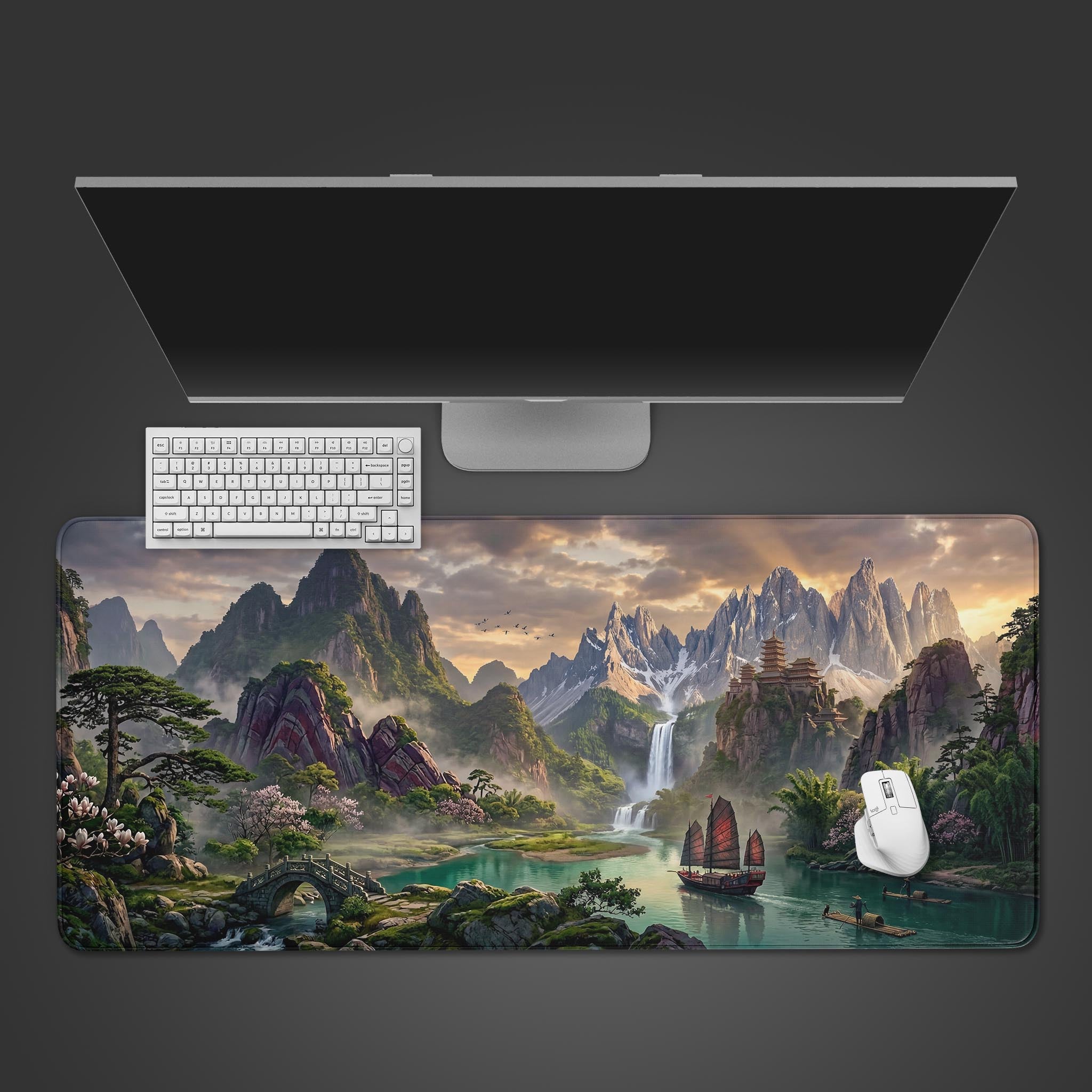 Top-down view of the Imperial River Valley gaming desk mat with its Chinese landscape art, arranged with a white keyboard, mouse, and monitor on a dark surface. - Epic Design Pads & Mousepads
