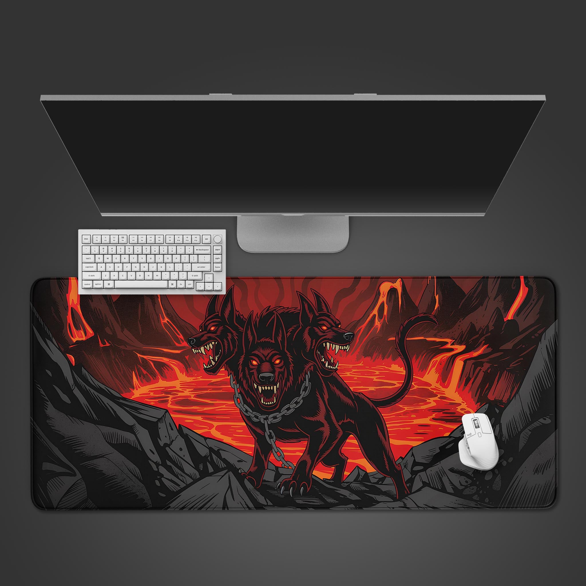 Infernal Hellhound desk mat with fiery three-headed dog design and lava background – desktop view with keyboard and mouse. - Epic Design Pads