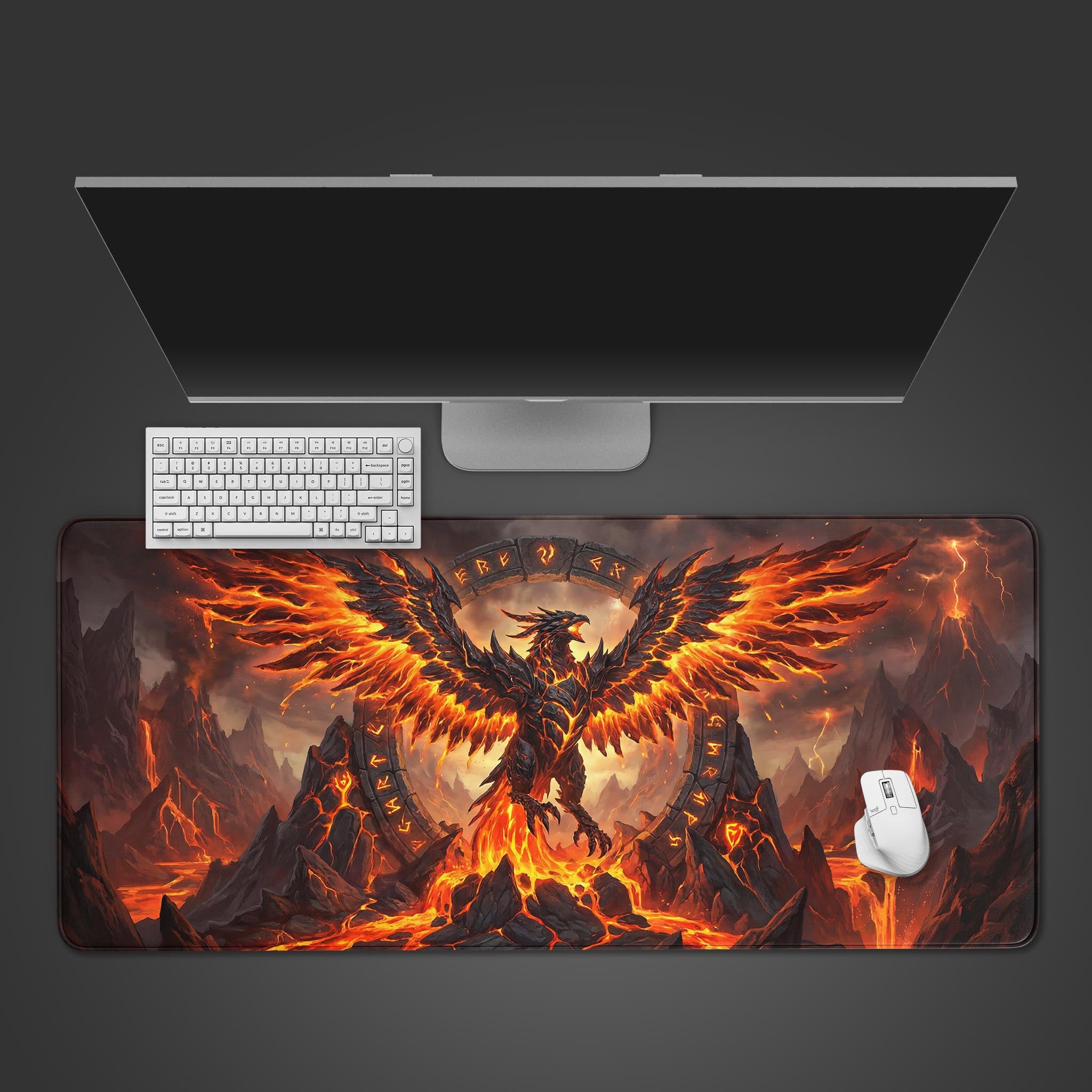 Top-down view of the Infernal Rise gaming desk mat featuring a fiery phoenix, with a white keyboard and mouse on a dark background. - Epic Design Pads & Mousepads