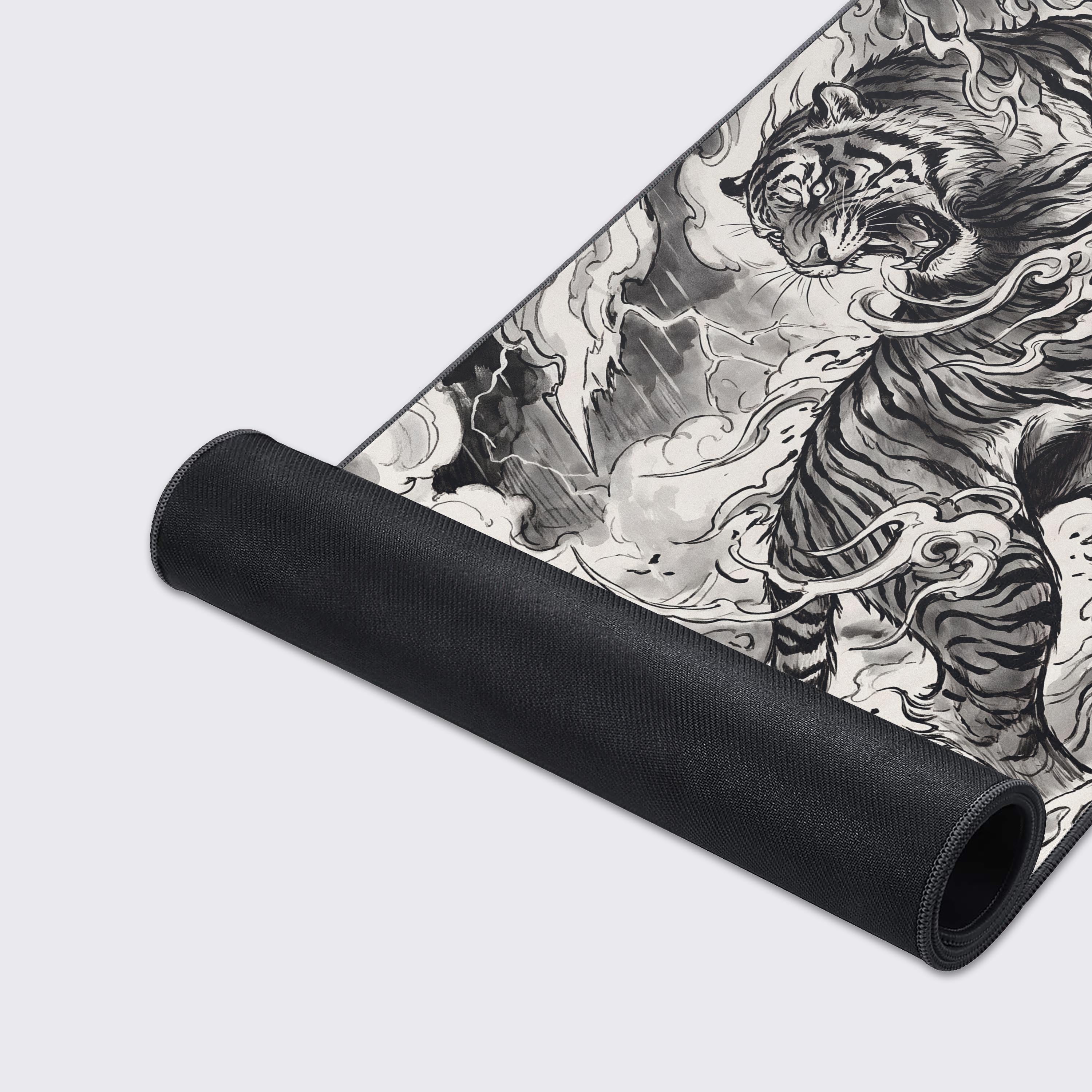 Top view of an ink wash style tiger desk mat highlighting a super smooth surface and non-slip rubber base.