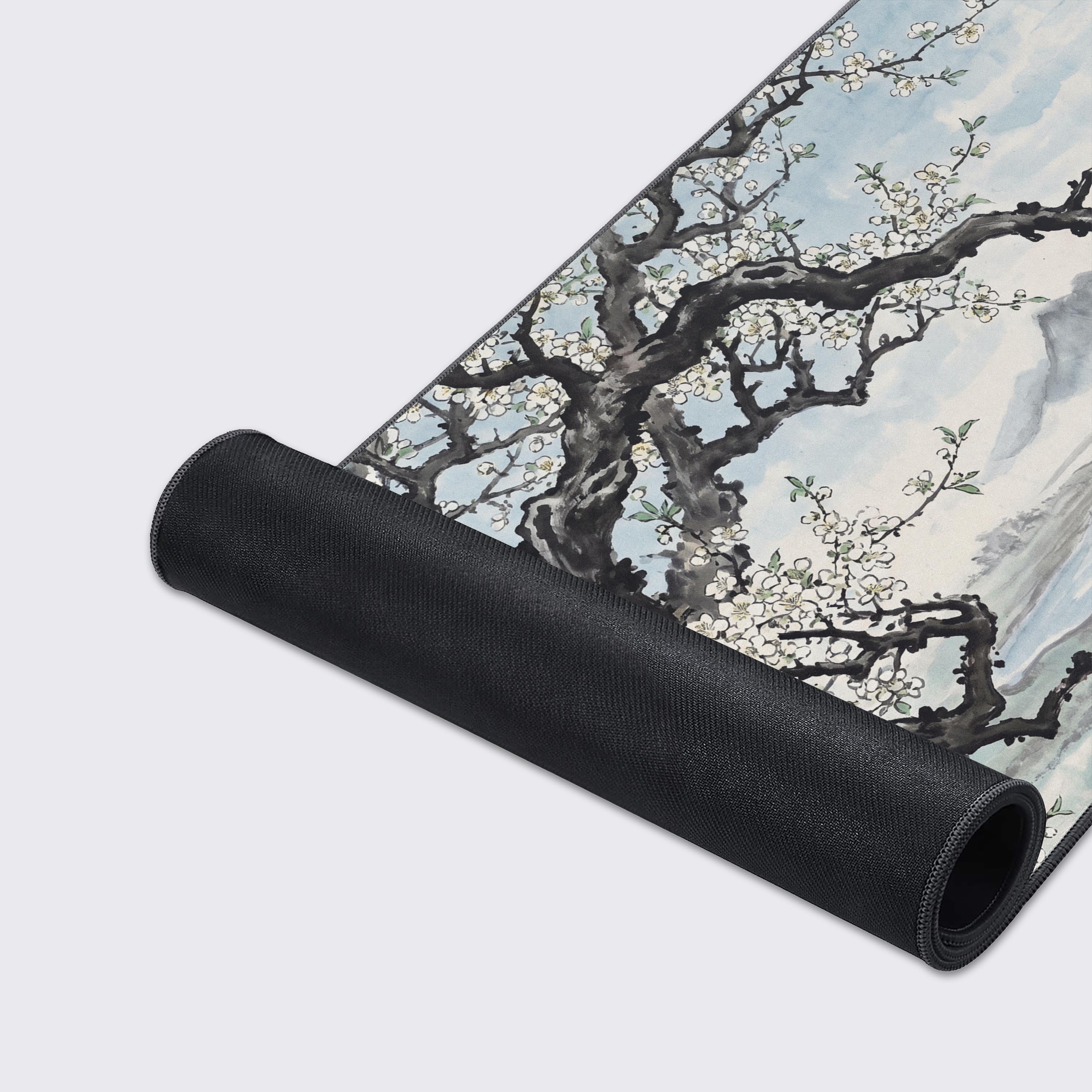 Serene mountain landscape and river watercolor art on a large gaming desk mat