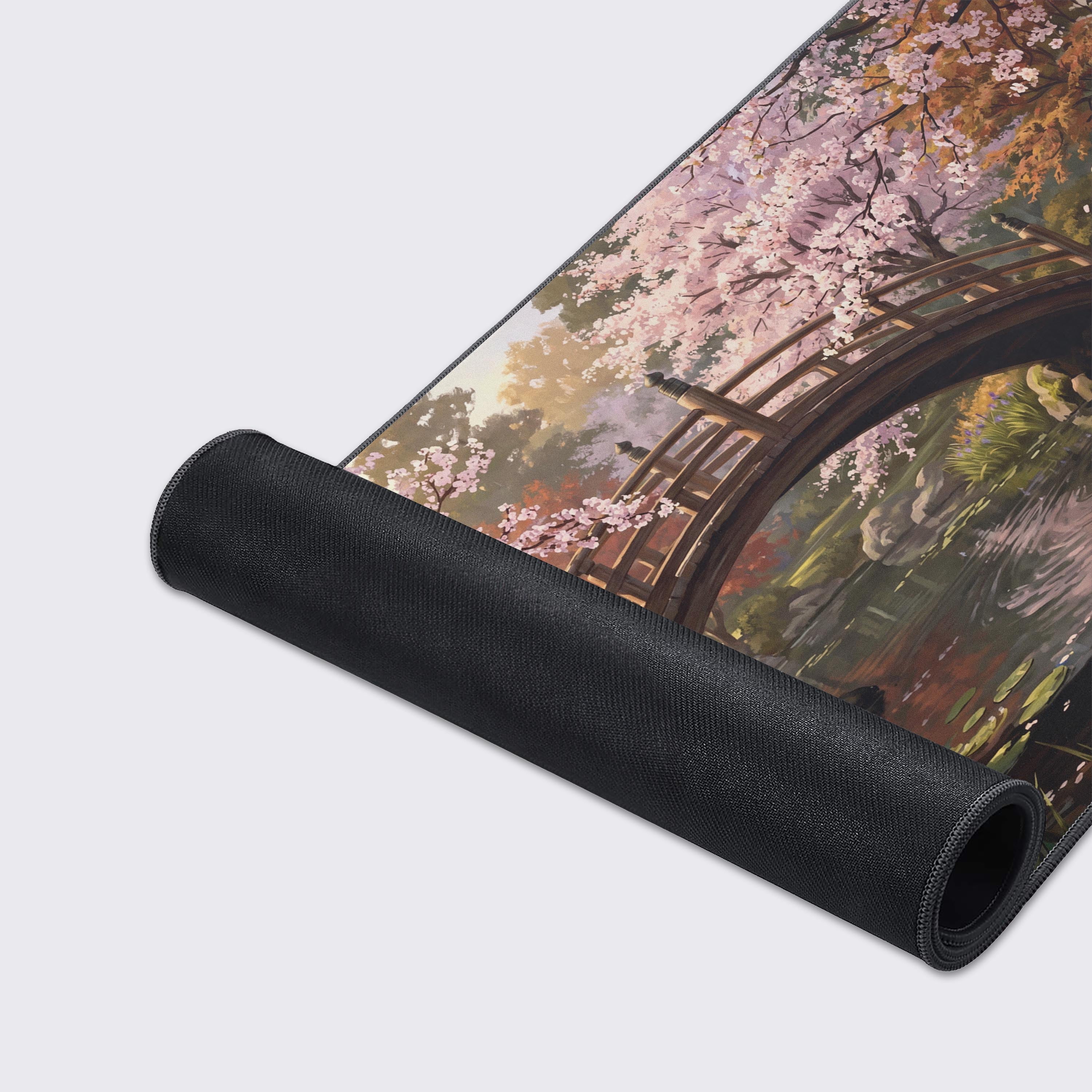 Detailed view of the traditional Japanese stone lanterns and cascading waterfall on the gaming mat.