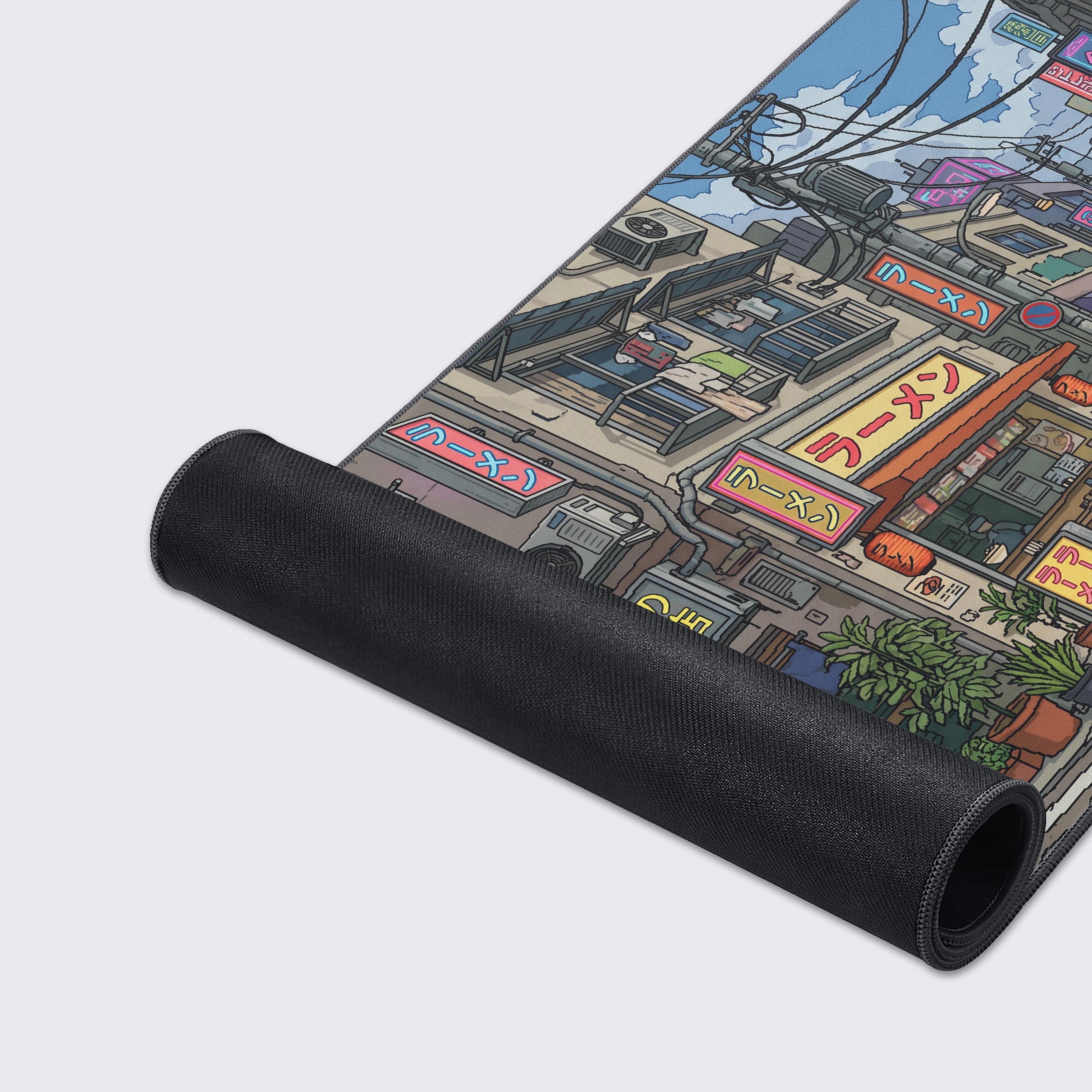 Close-up of the desk mat design featuring a retro Japanese vending machine and intricate city power lines against a blue sky.