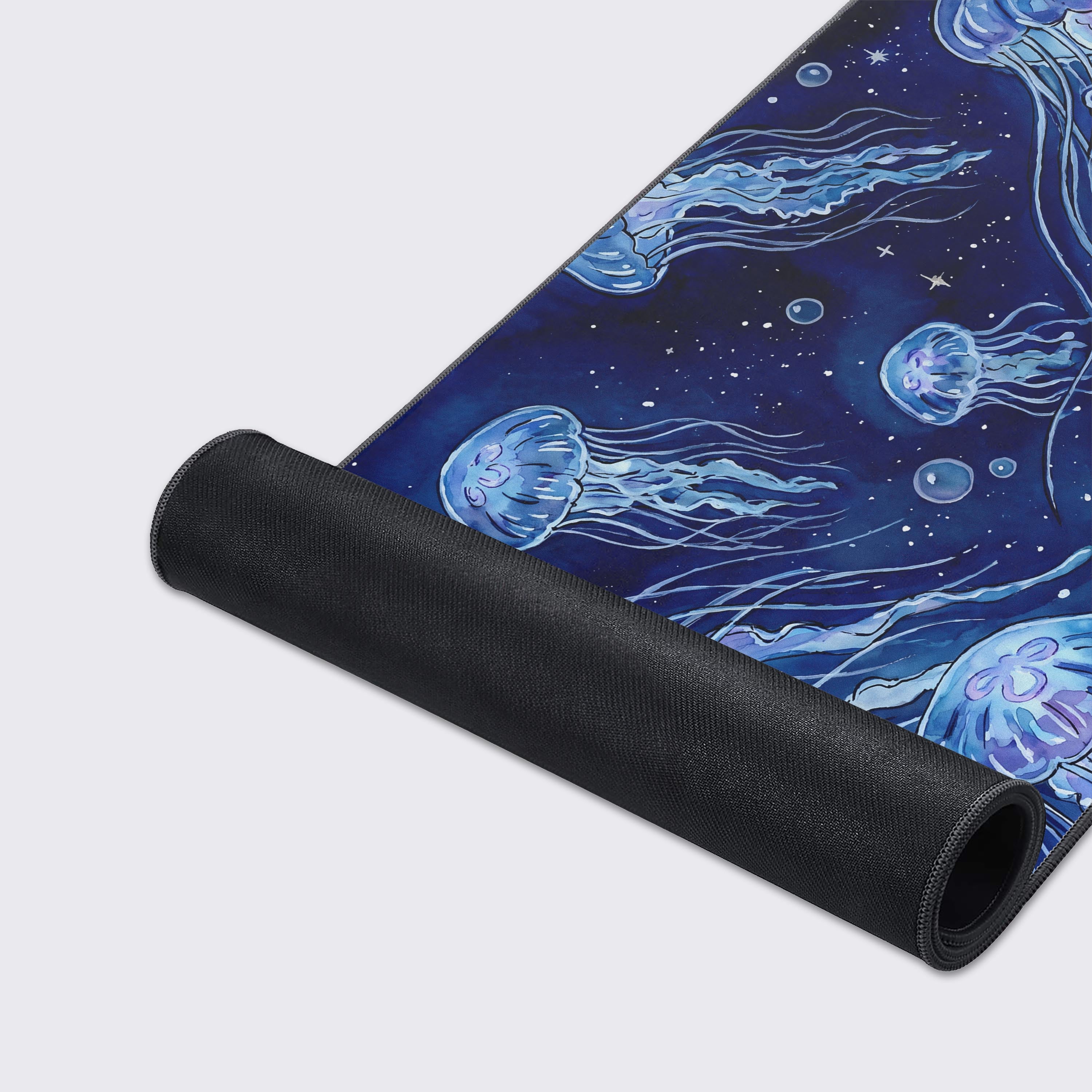 Highlighting the waterproof, non-slip rubber base and easy-to-clean features of the Jellyfish desk mat