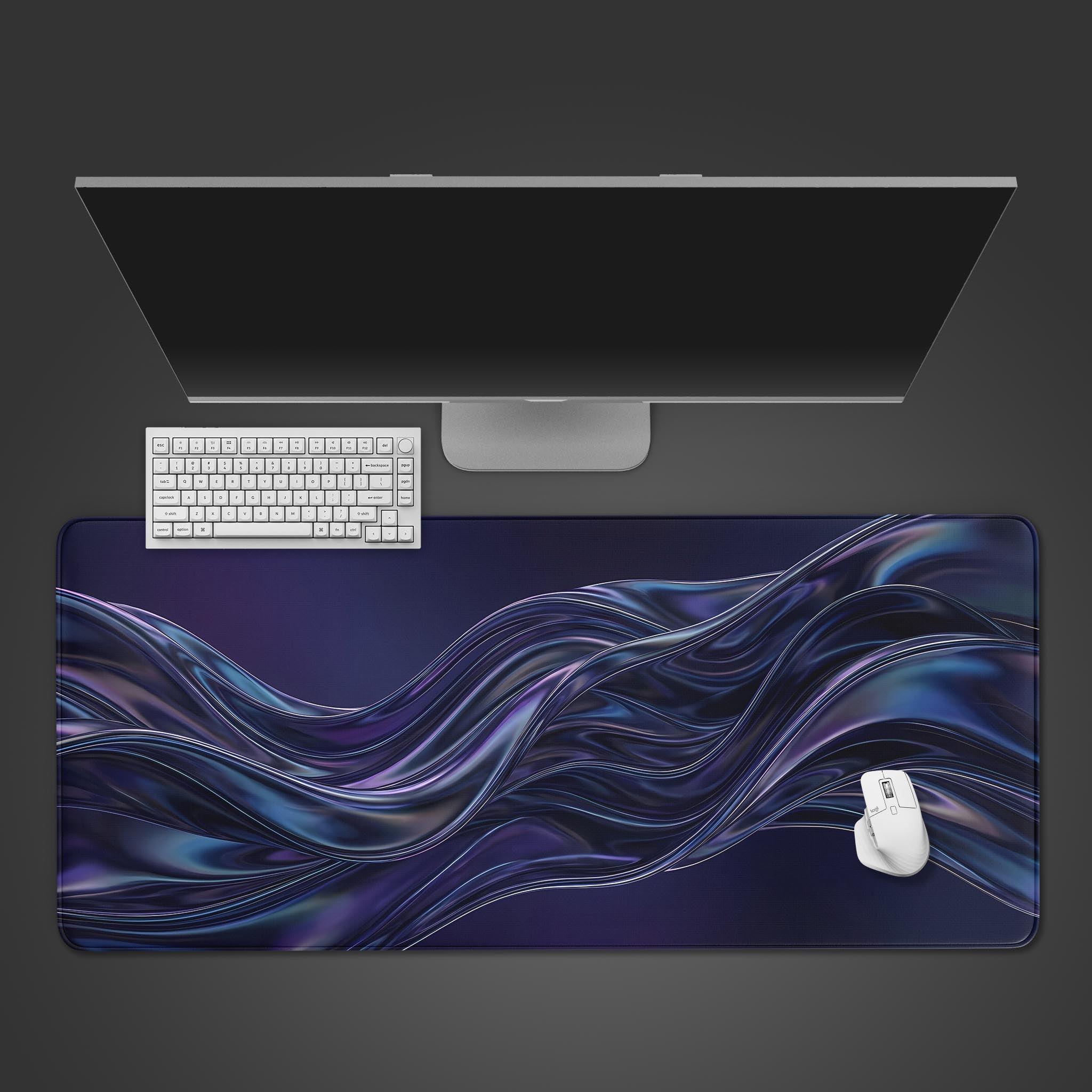 Top-down view of the Kinetic Flow gaming desk mat, featuring a liquid metal wave design, with a white keyboard and mouse on a dark background. - Epic Design Pads & Mousepads